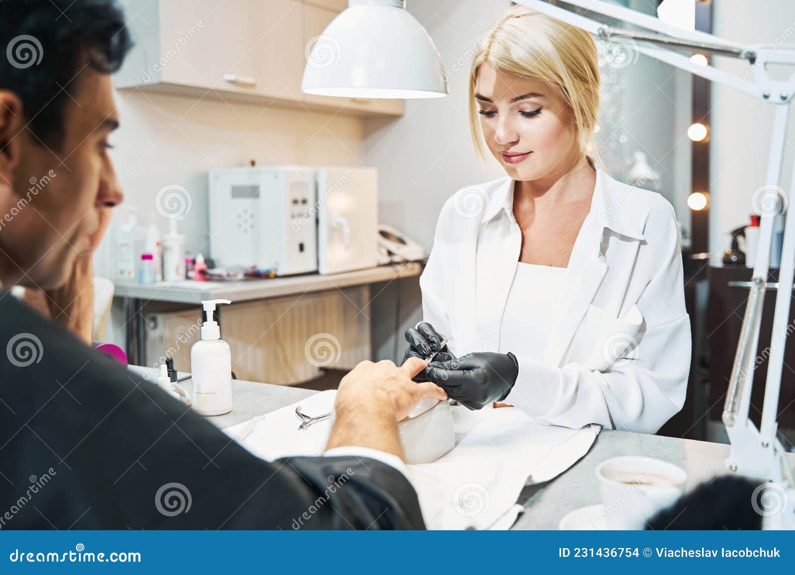 Woman Nail Technician Working on Male Nail with Cuticle Pusher Stock Photo - Image of artist, manicurist: 231436754 Woman Nail Technician Working on Male Nail with Cuticle Pusher Stock Photo - Image of artist, manicurist: 231436754