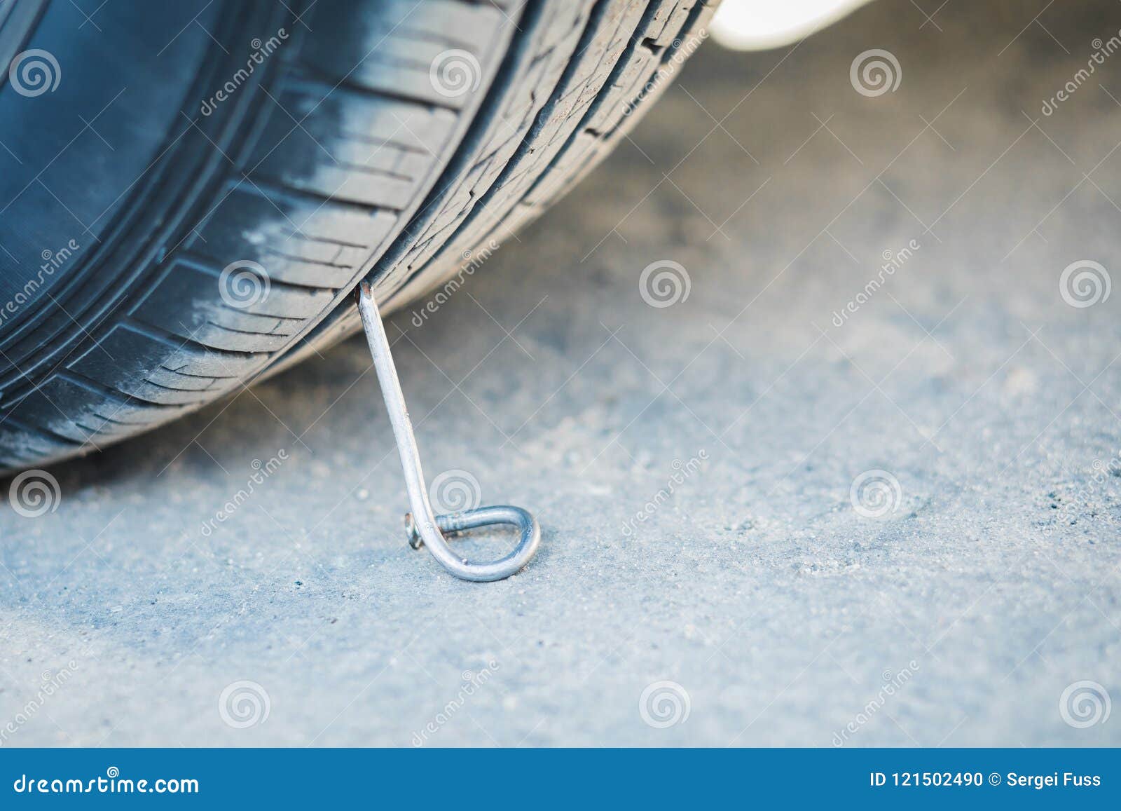 Nail on an Asphalt Road with a Car. Stock Photo Image of hard, flat