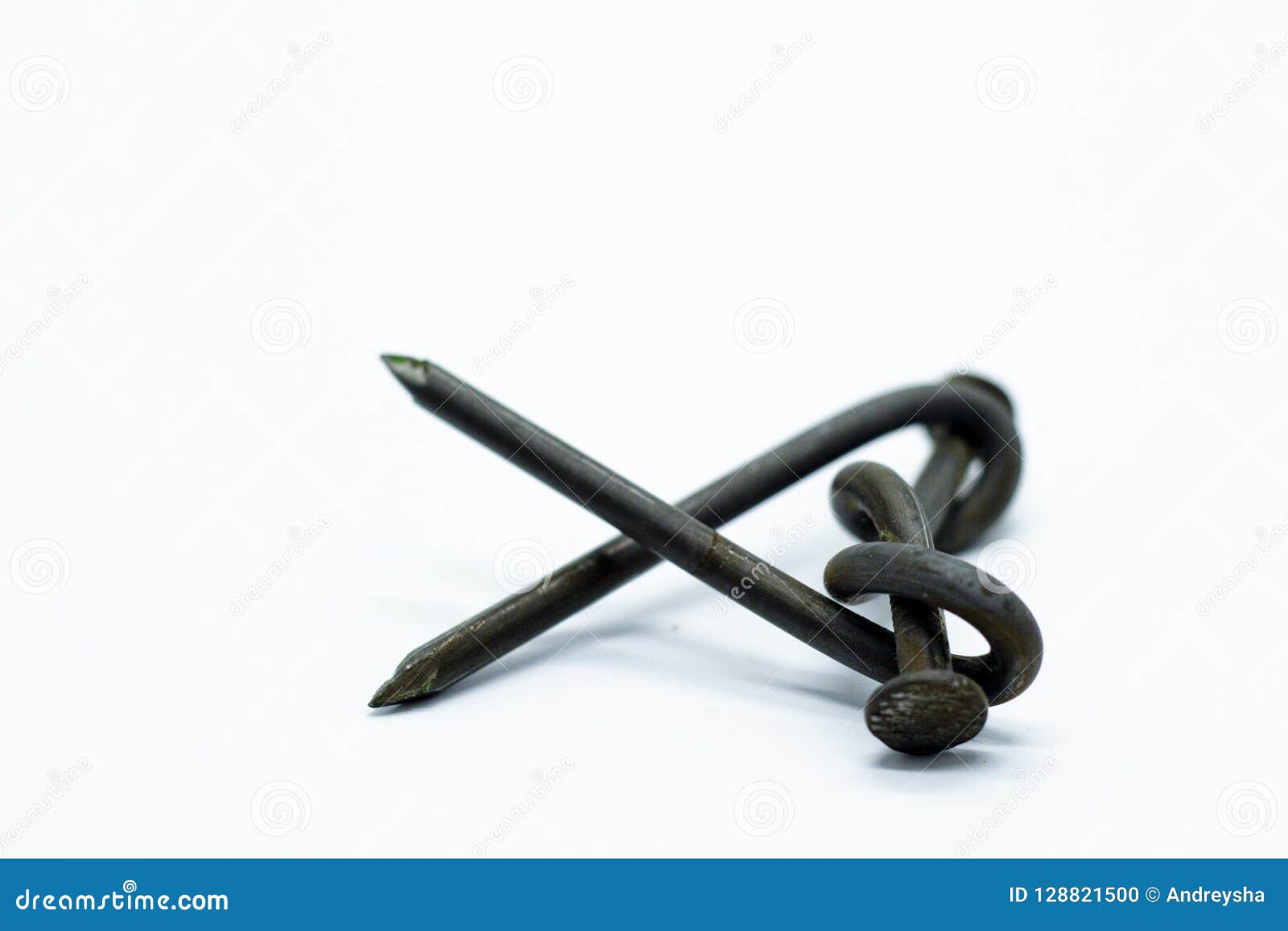 The Nail is Bent. Twisted Two Nails on Isolated Background. Stock Photo
