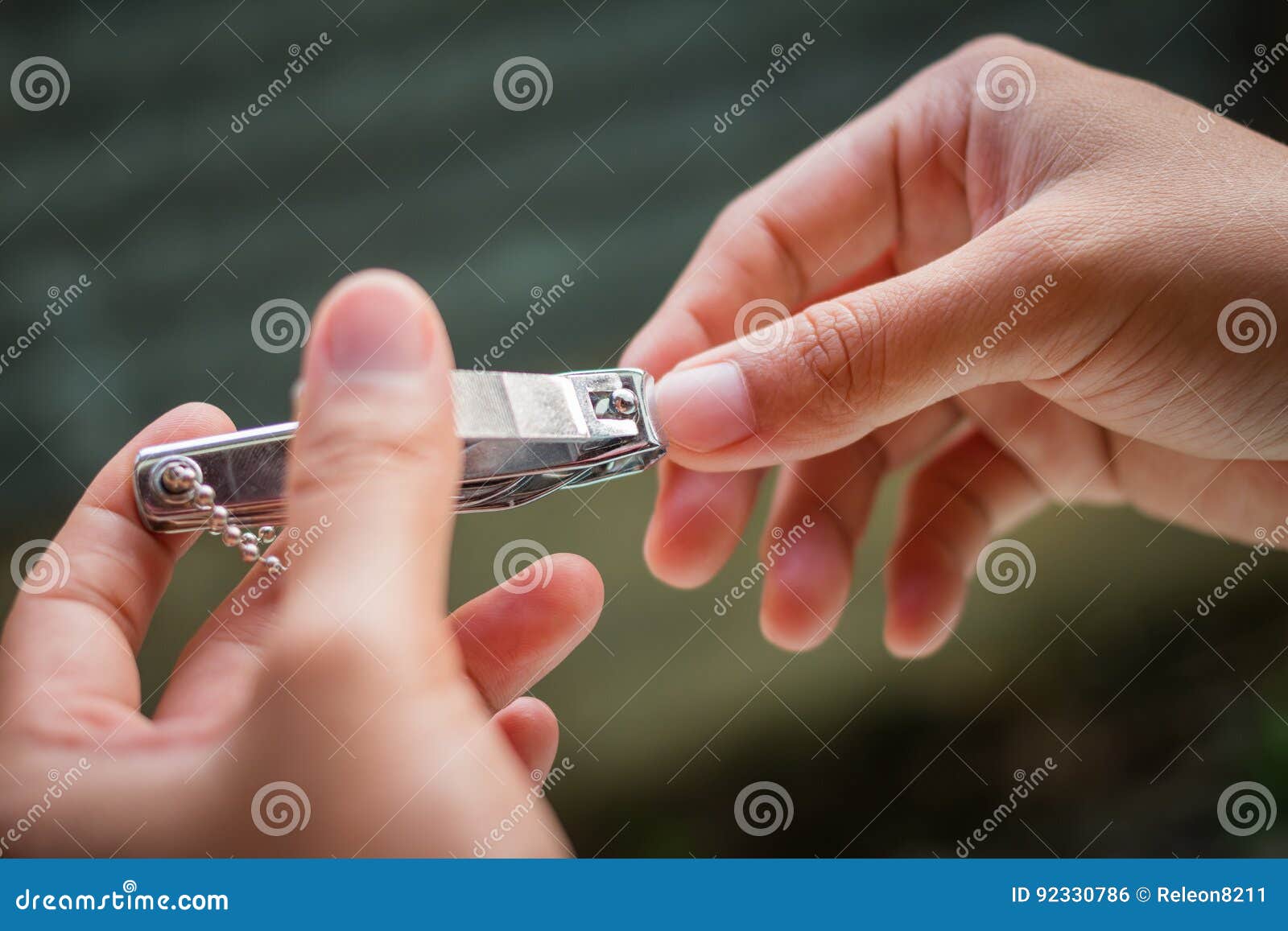 Nail clipper in hands stock photo. Image of clip, hands 92330786