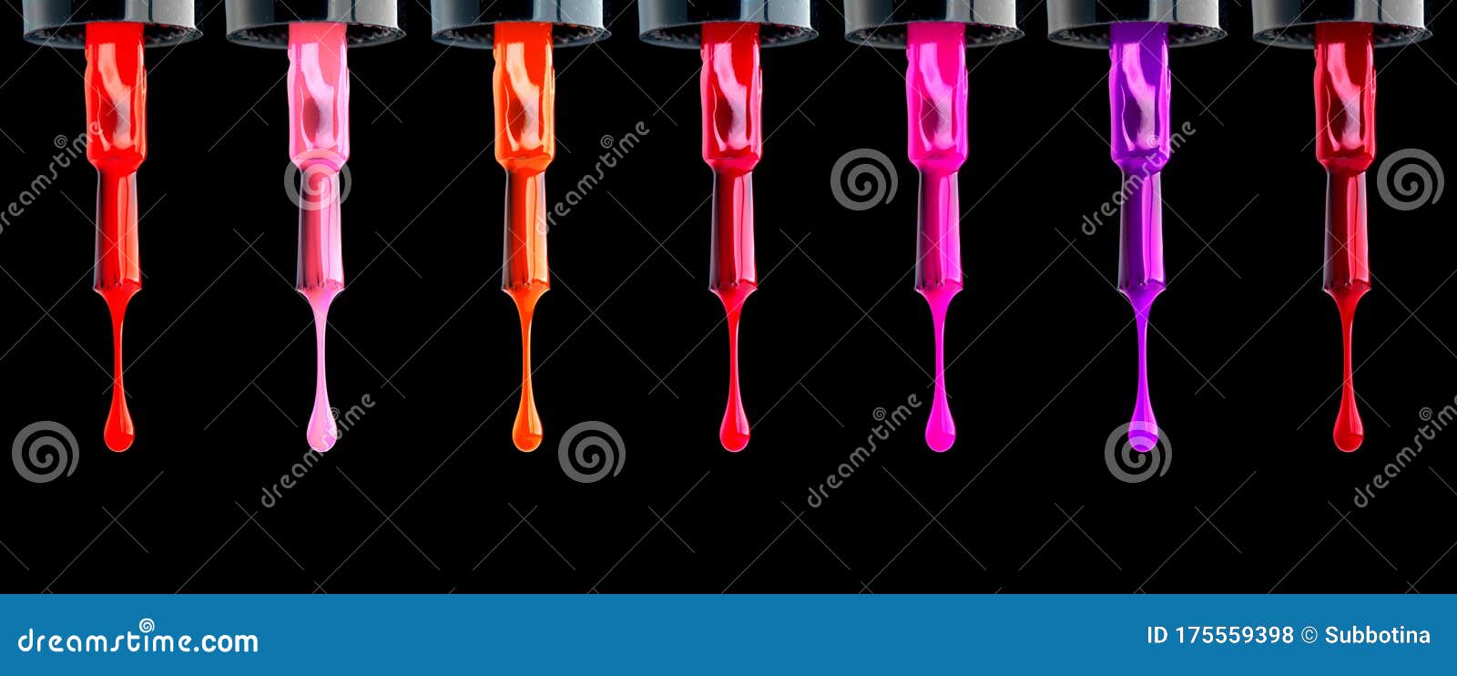 nail polish. colorful various nailpolish drops on brush,  on black background. fashion beautiful nail art