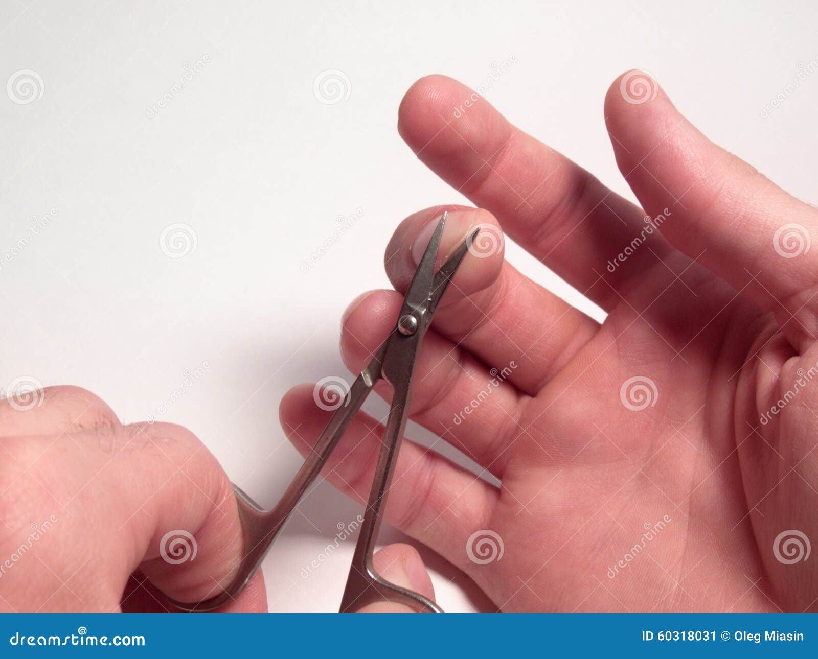 Nail Scissors in the Process of Cutting Nails on a Man S Hand Stock