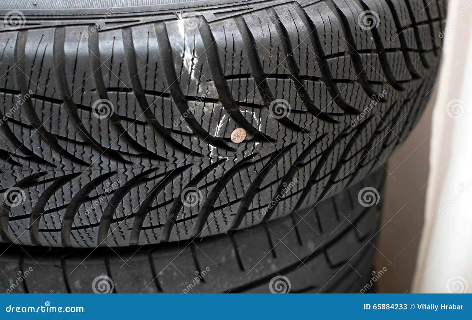 Nail in tyre stock image. Image of transportation, nail 65884233