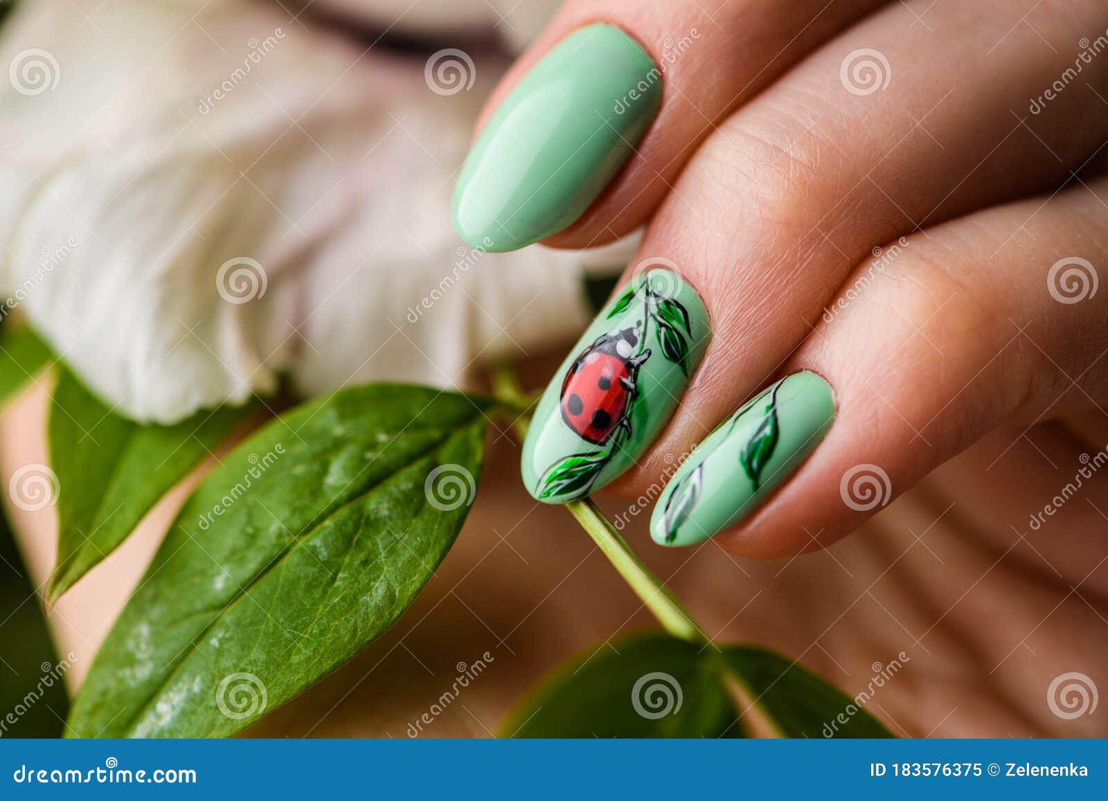Nails Design. Hands with Bright Green Manicure with Flowers. Close Up ...