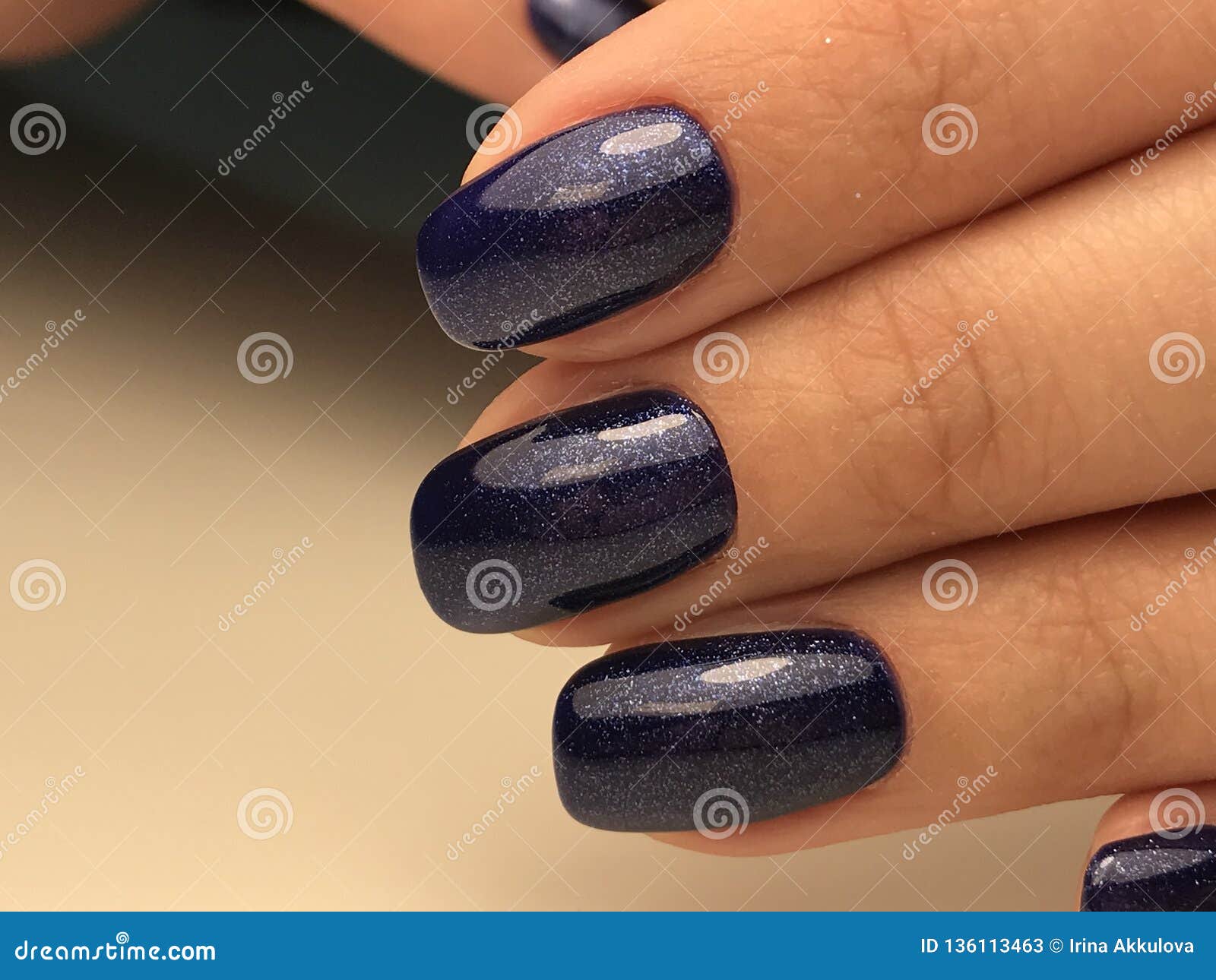 Female with navy blue nails polish holding decorative hank. Manicure  concept image. Close up, selective focus Stock Photo | Adobe Stock