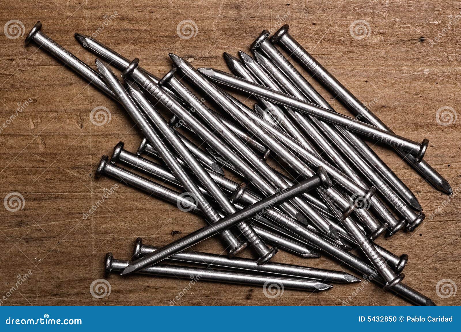 Nails on wooden table. stock photo. Image of steel, nail - 5432850