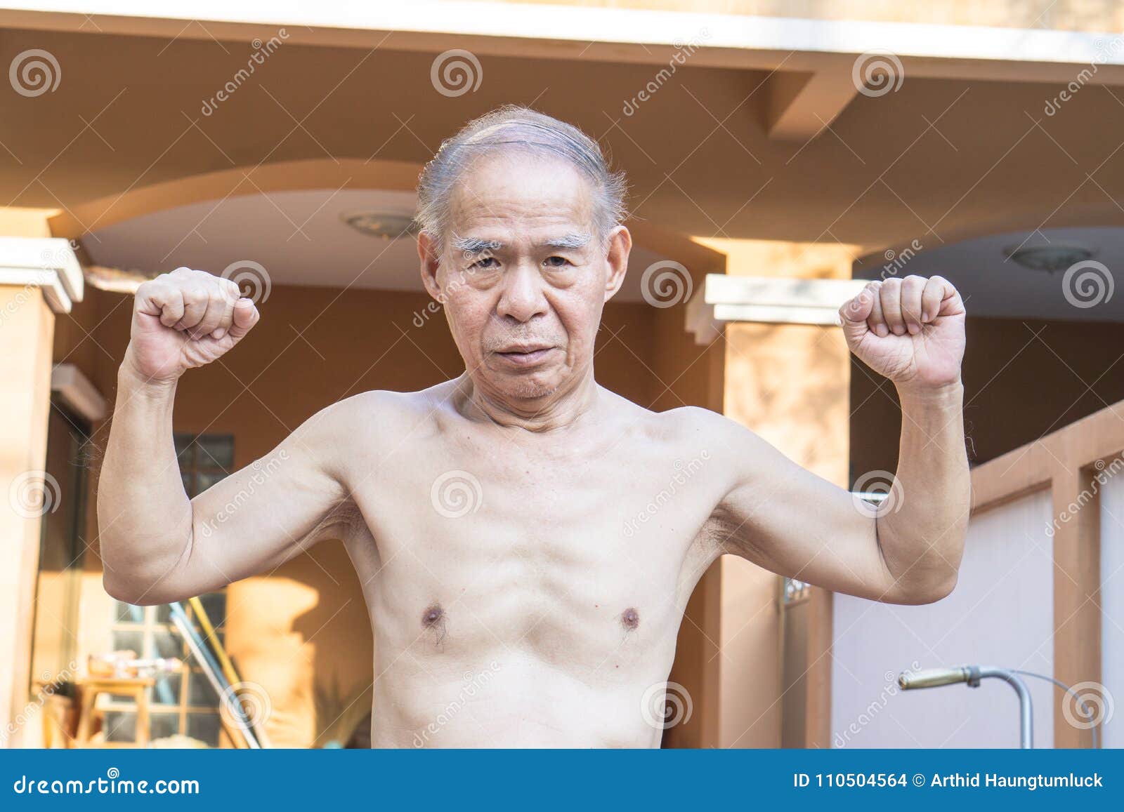 Naked Asia Man Posing And Showing His Muscles At The Outdoor Park