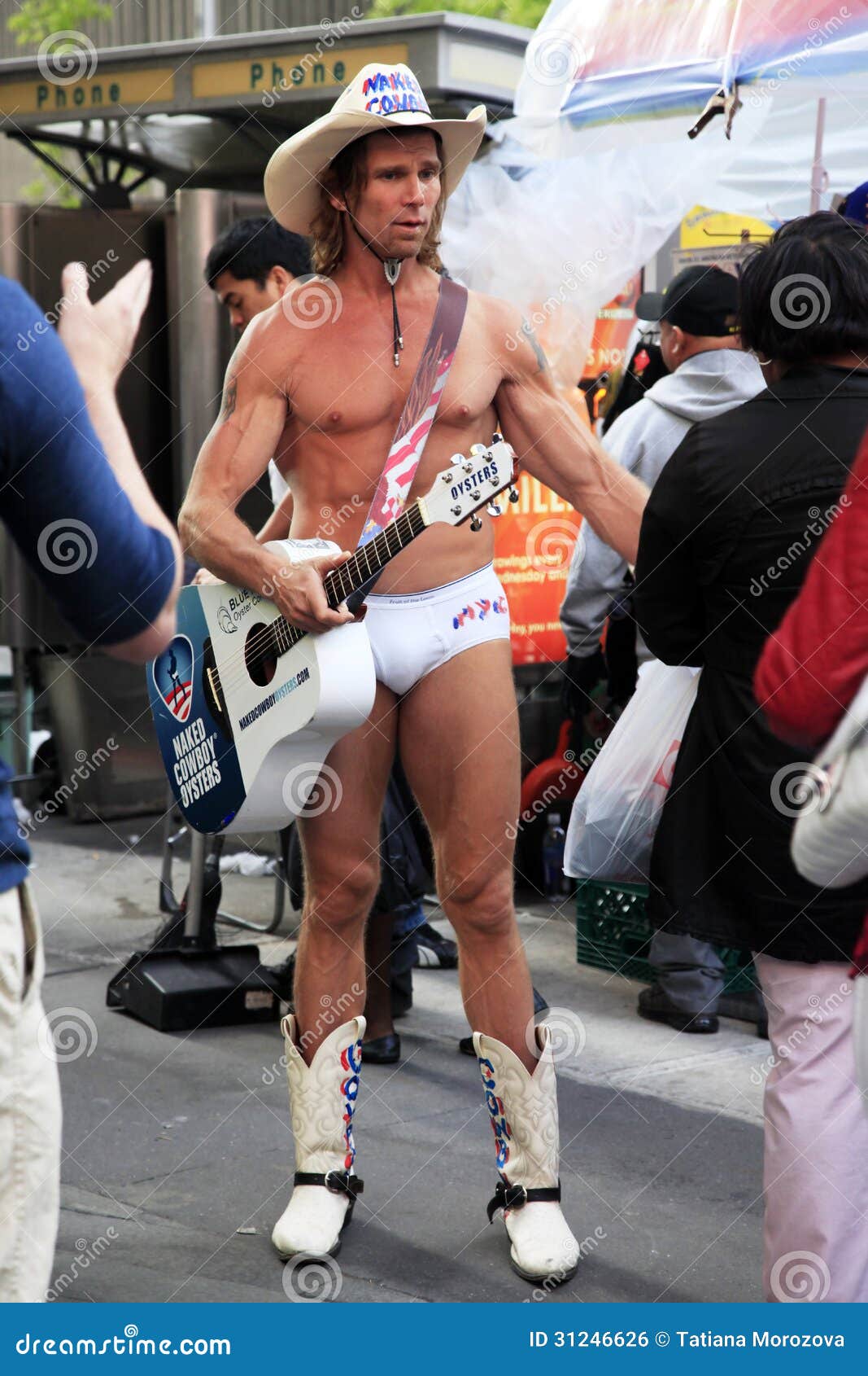 Naked Cowboy Robert Burck Is Playing His Guitar In The 