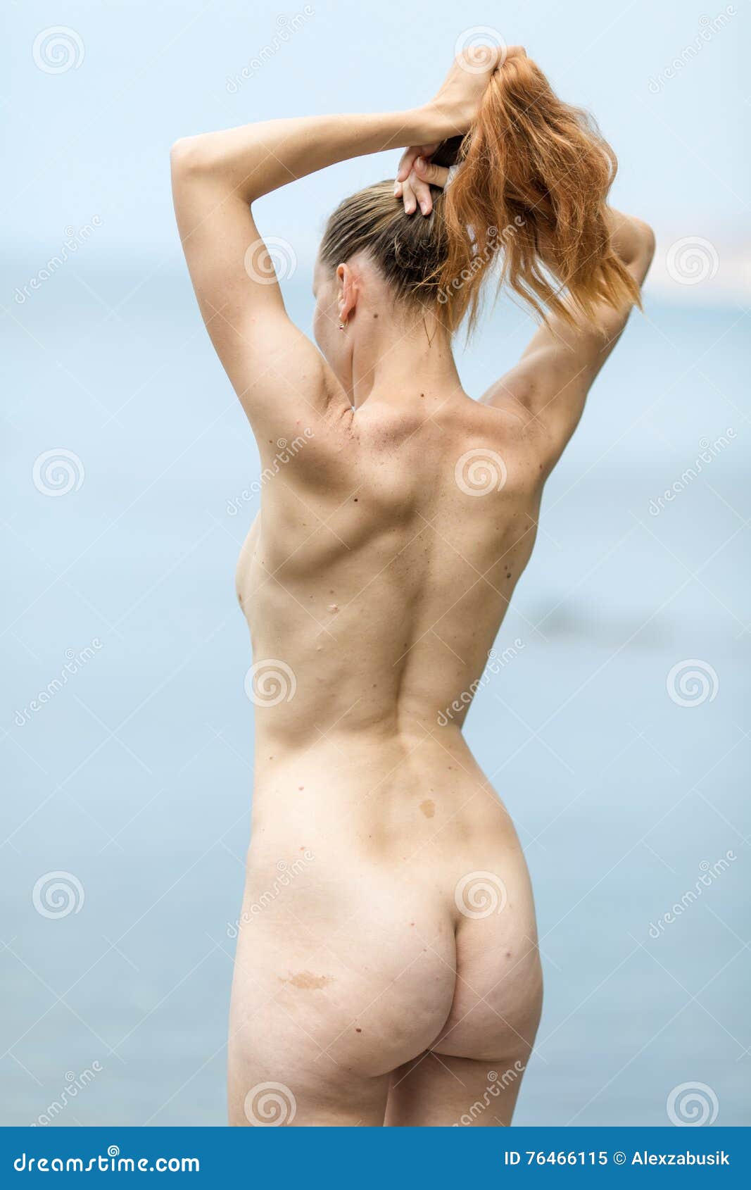 Naked Female Adjusts Hairstyle, Rear View Stock Image - Image of