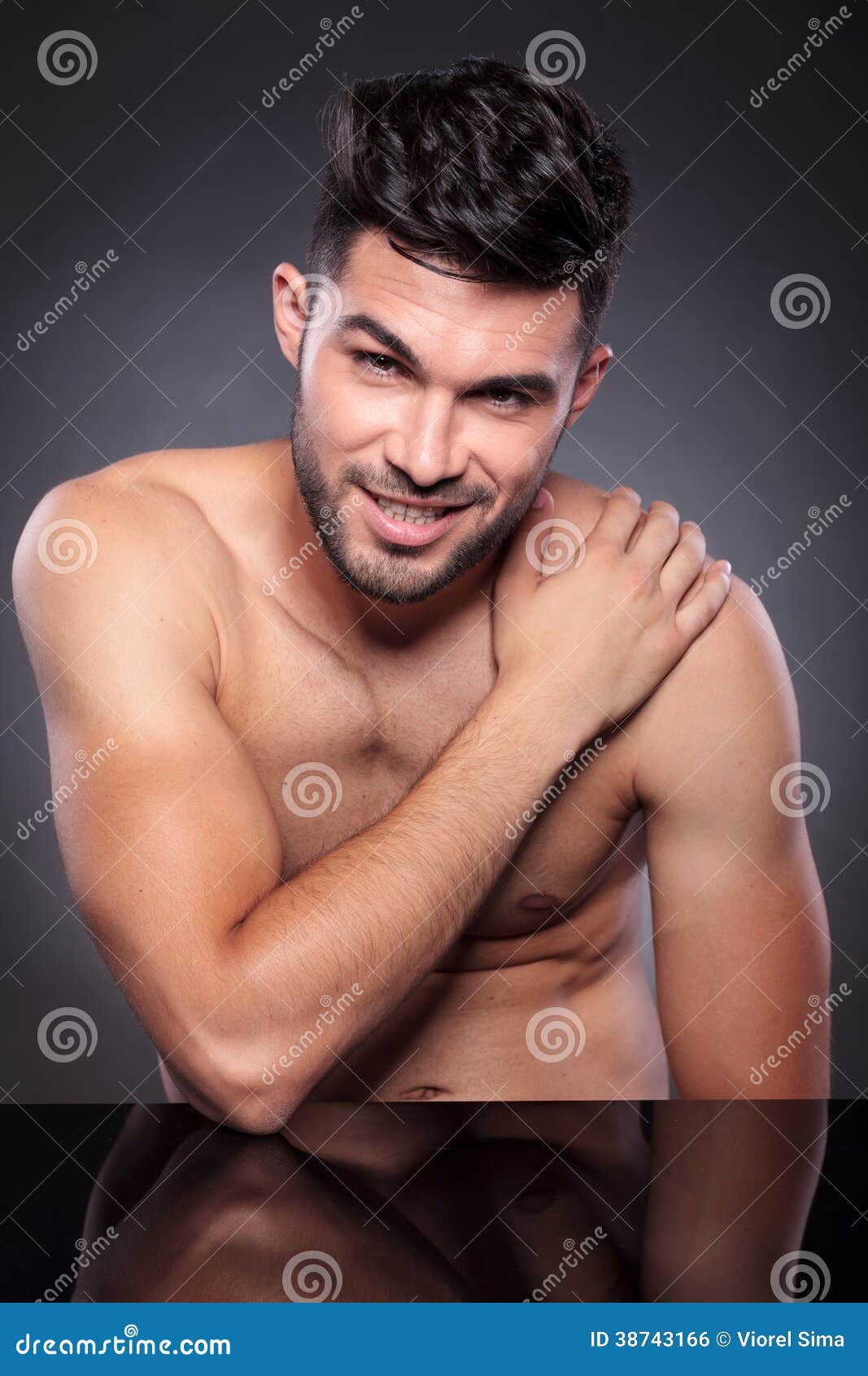 Naked Man Smiles With Hand On Shoulder Stock Photo - Image 