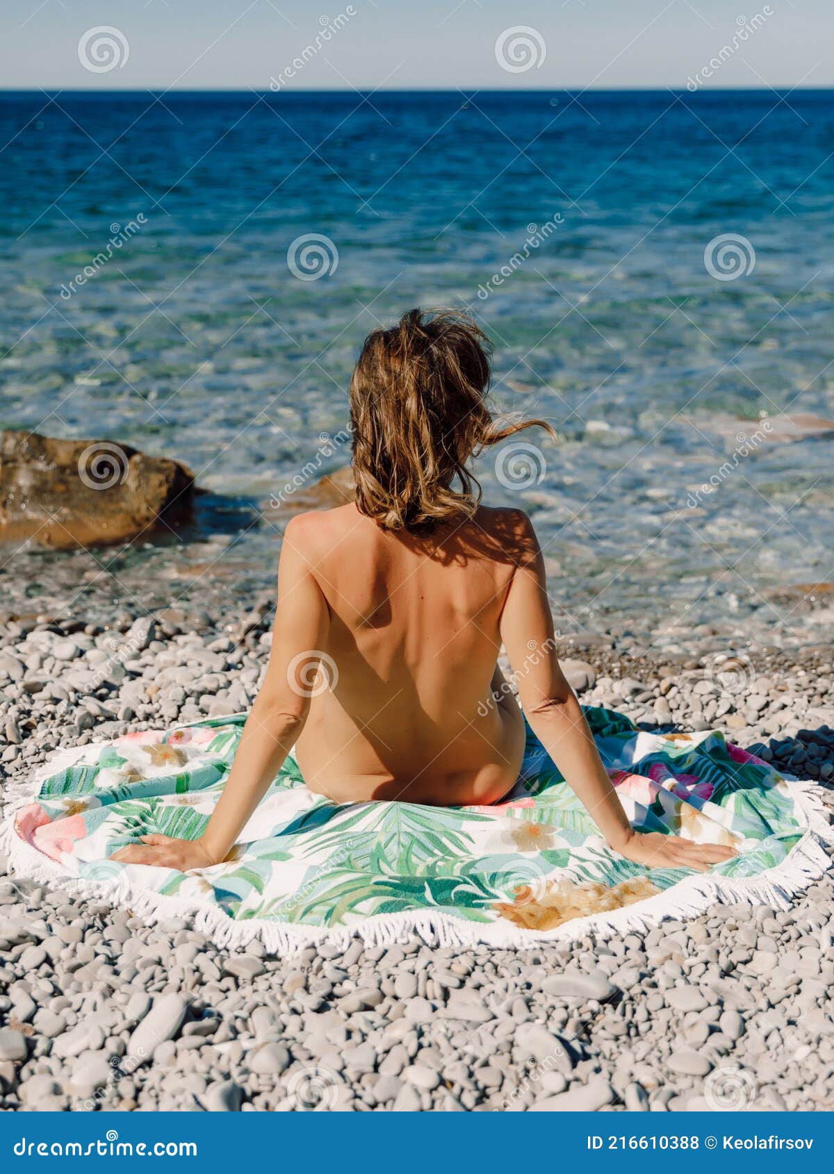 Appealing naked babes are relaxing on the beach