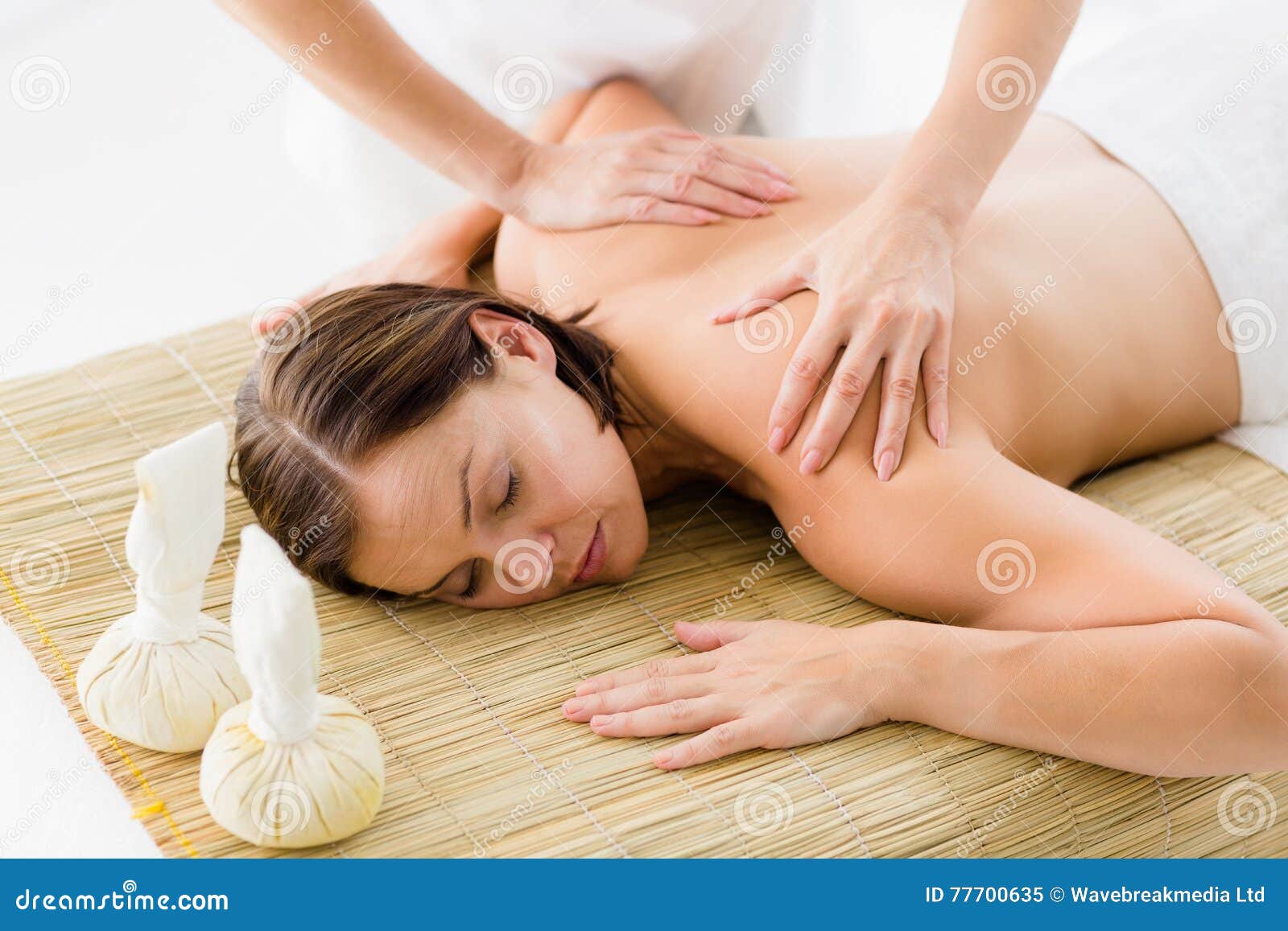 Naked women getting a massage