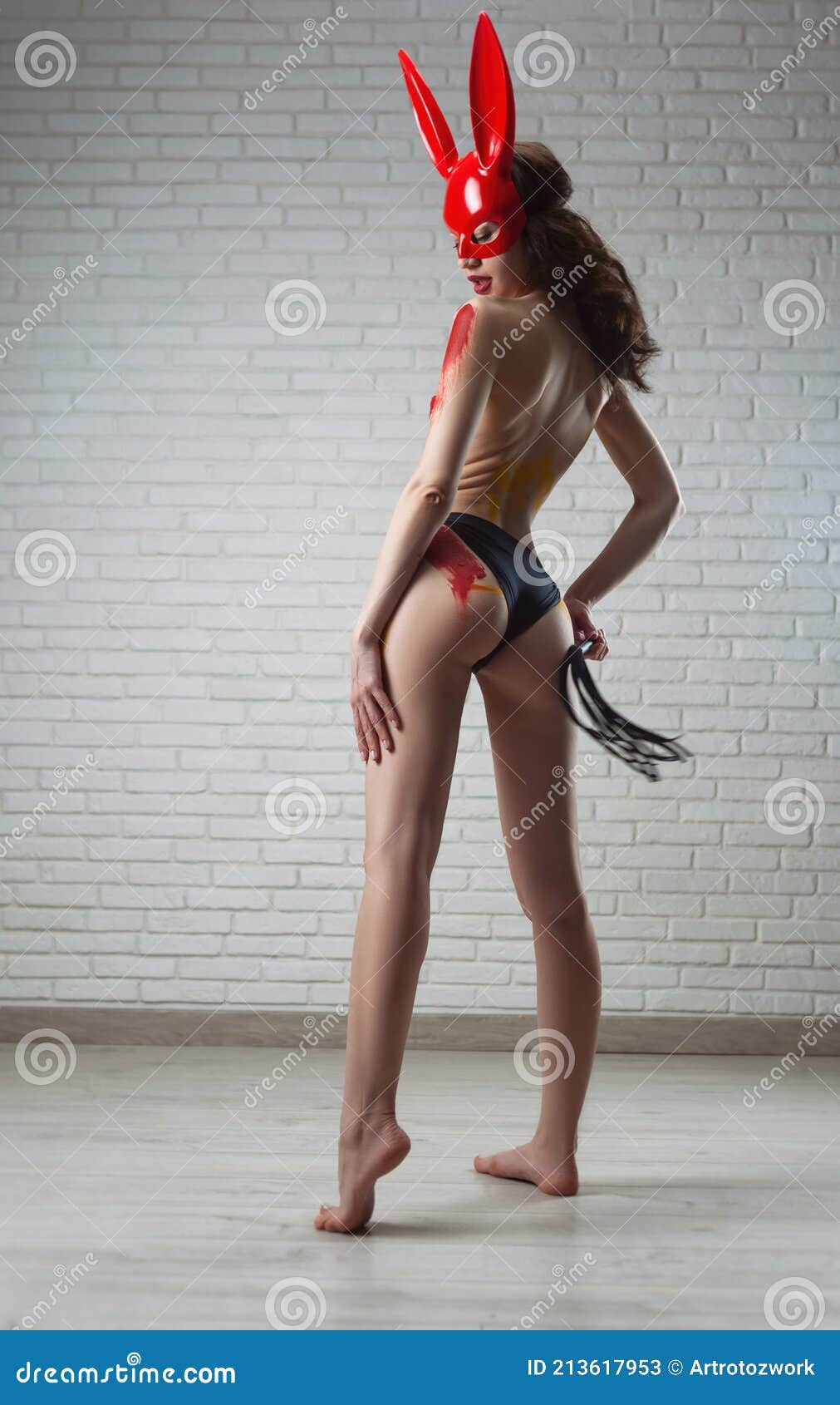 A Naked Woman in a Red Rabbit Mask Poses Against a Brick White Wall with a  Bdsm Whip Stock Image - Image of repair, roller: 213617953