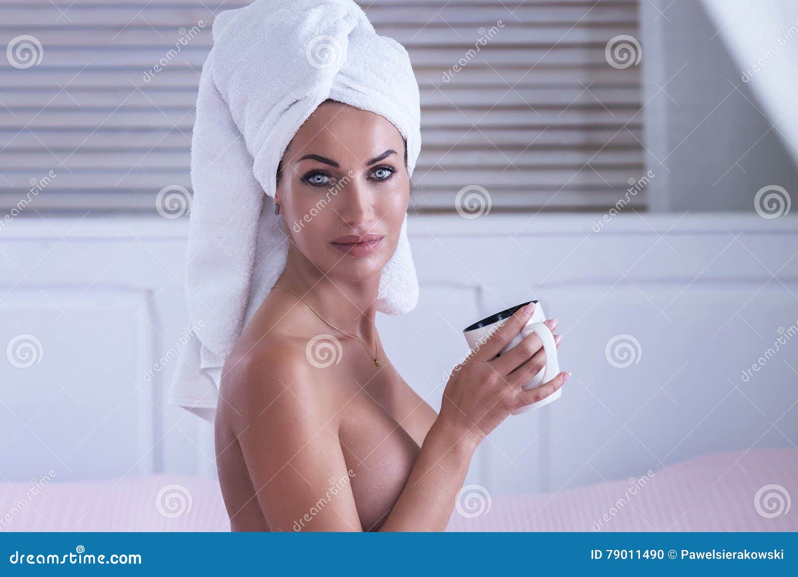 Photo about Attractive beautiful woman with white towel on head posing nake...