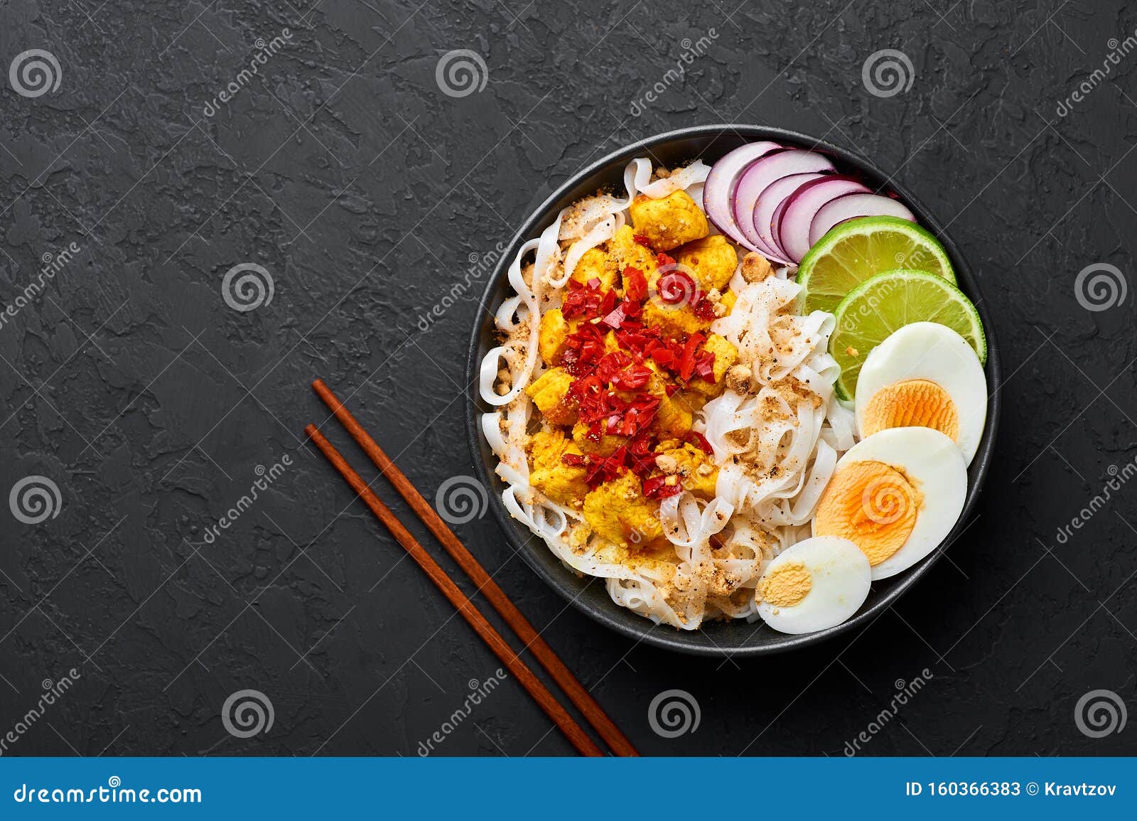 Nan Gyi Thoke in Black Bowl at Dark Slate Background. Nan Gyi Thohk is ...