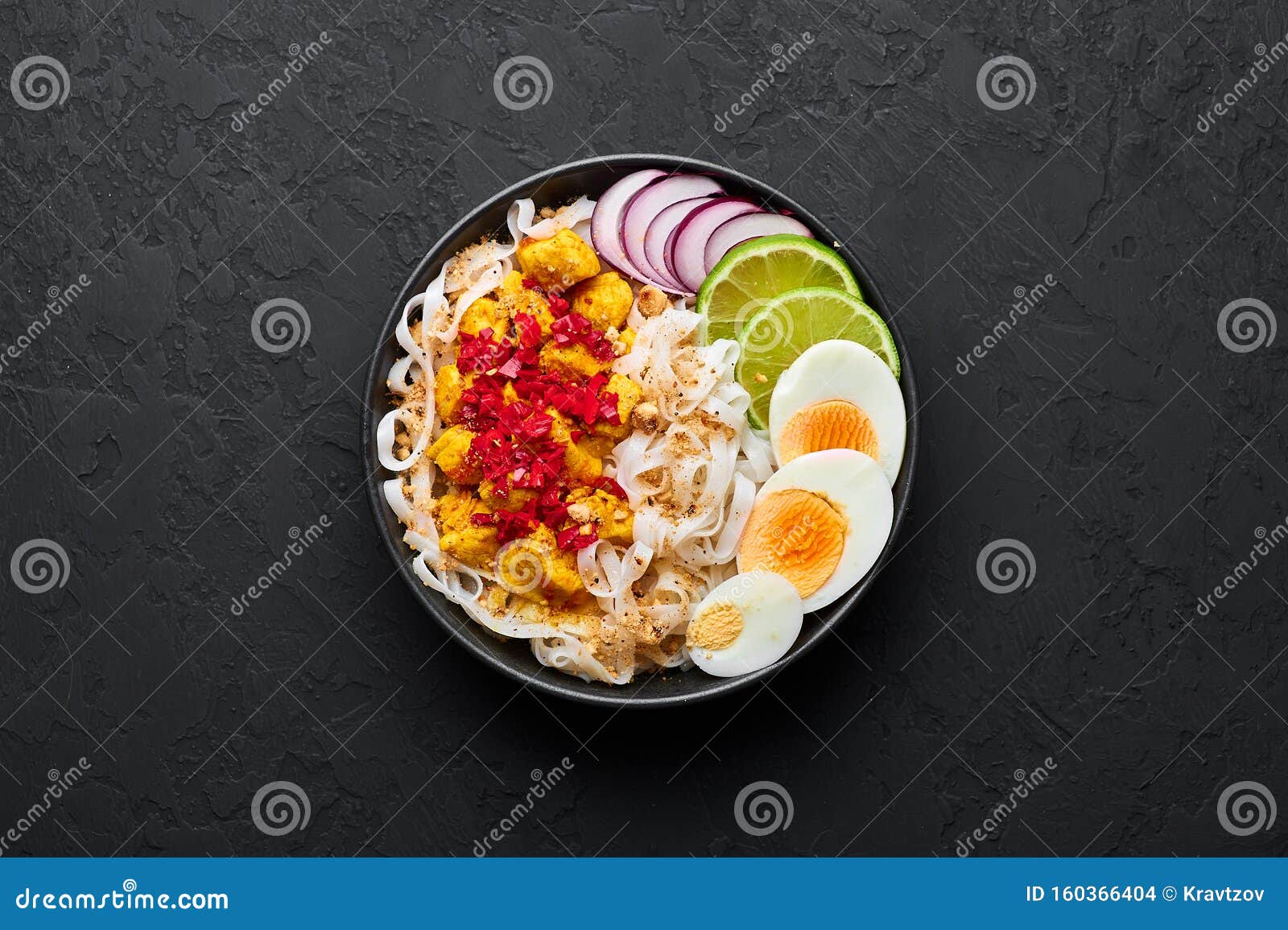 Nan Gyi Thoke in Black Bowl at Dark Slate Background. Nan Gyi Thohk is ...