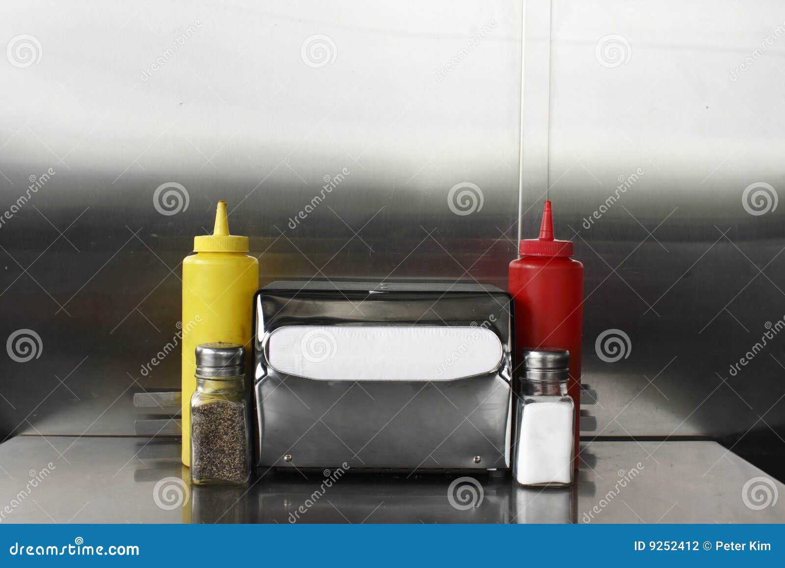 Napkin Dispenser and Condiments Stock Photo Image of diner, catsup