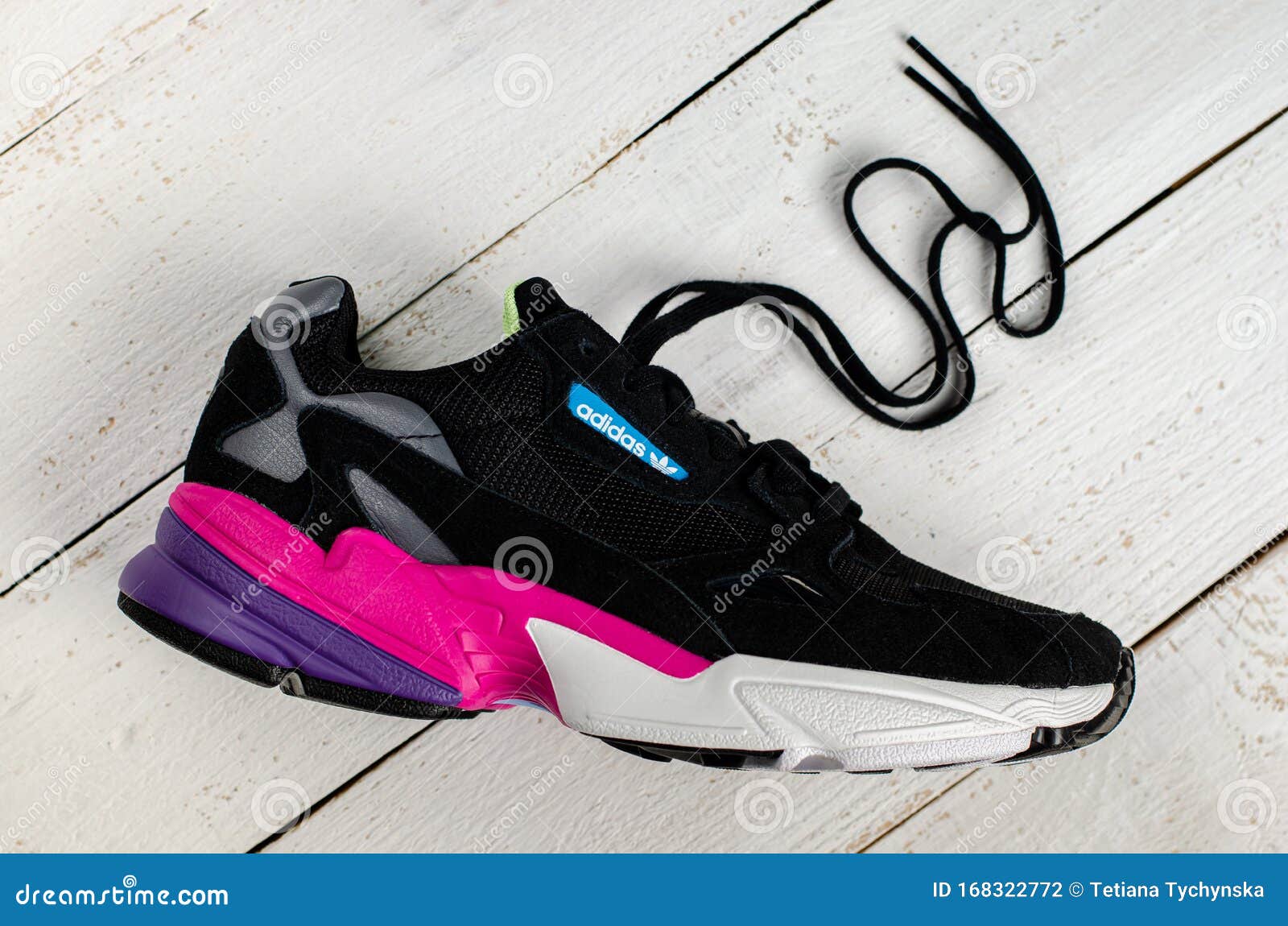 Supersonic speed dizzy in front of Adidas Originals Women`s Falcon Shoes. Cool Trendy Colorful Sneaker on  White Wooden Editorial Photography - Image of falcon, comfortable: 168322772