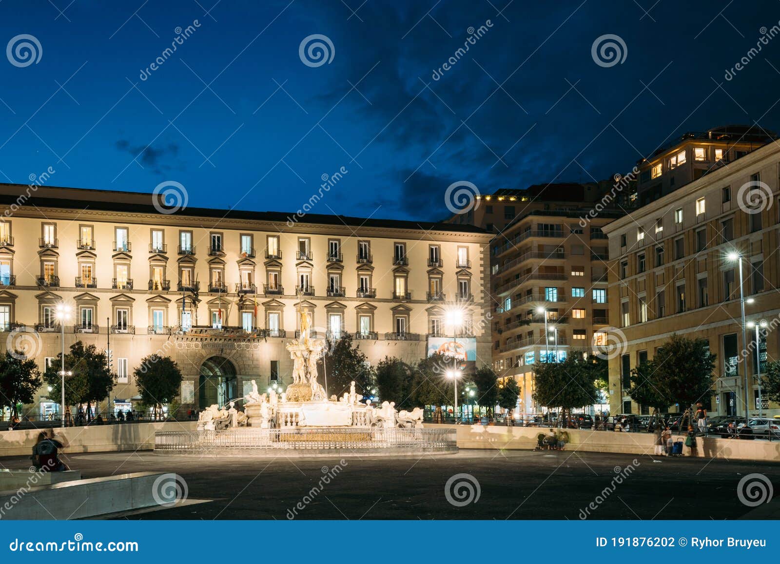 naples, italy. fountain of neptune on piazza municipio in evening or night illuminations