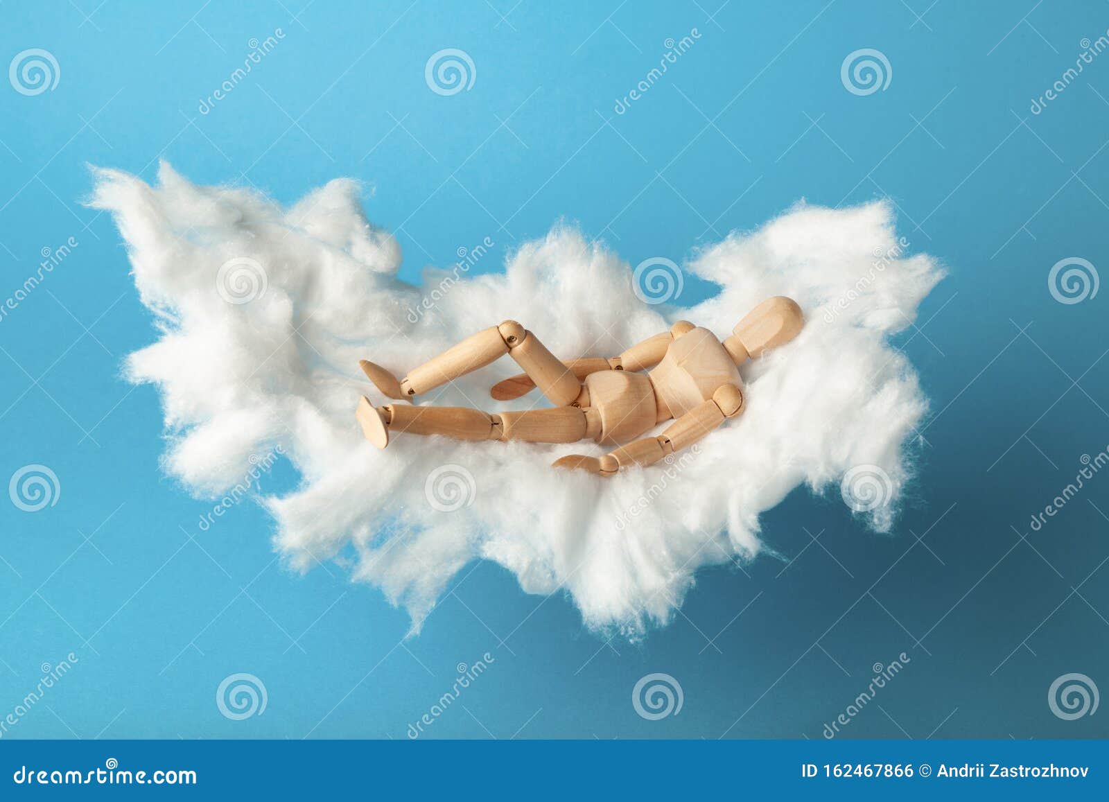 napping toy man on comfortable cloud bed. relax and dream