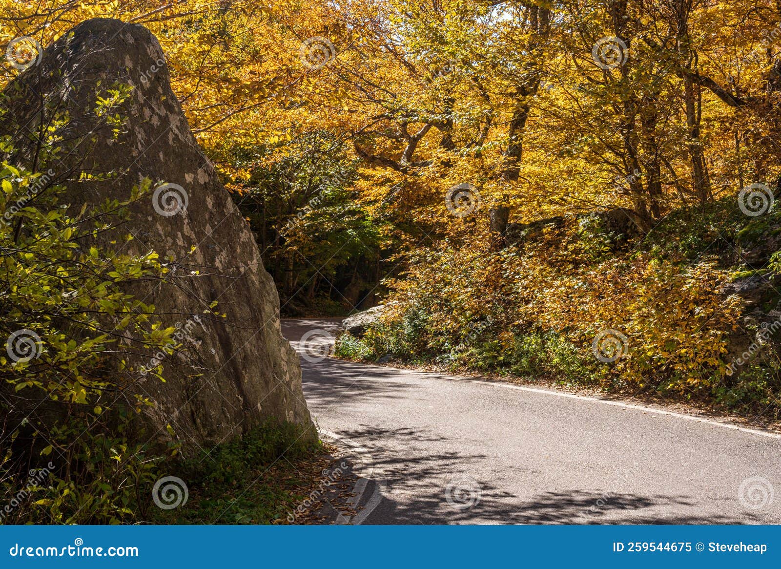 narrow road in smugglers notch near stowe in vermont