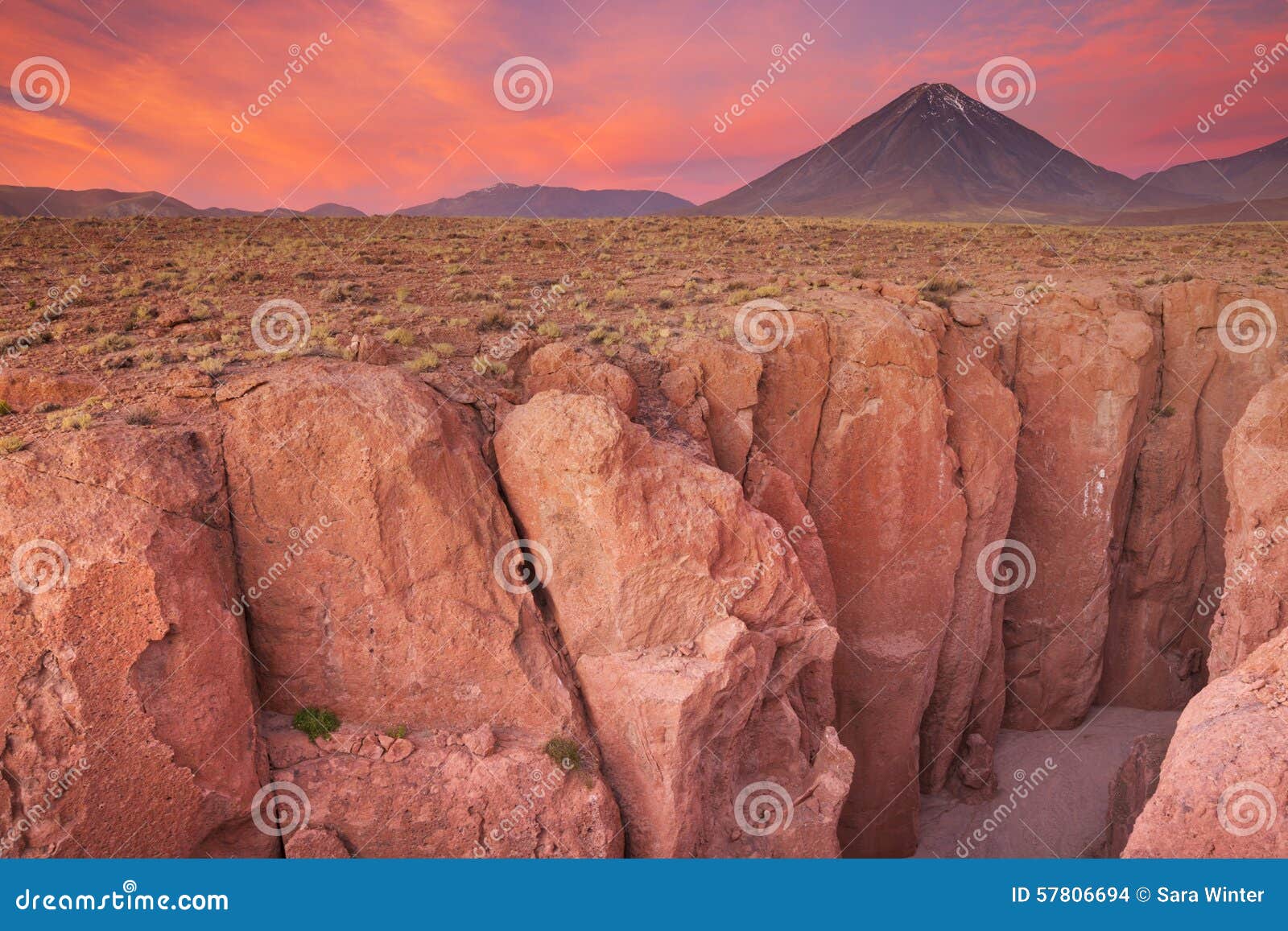 narrow canyon and volcan licancabur, atacama desert, chile at su