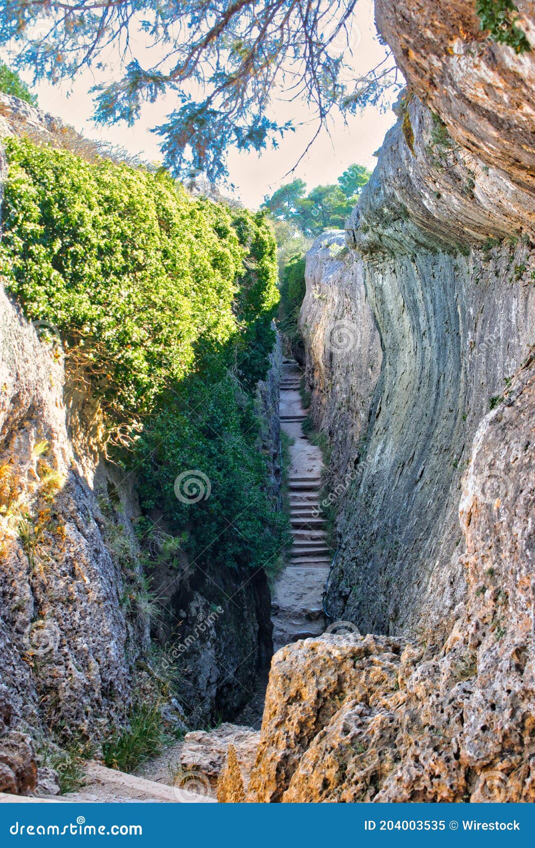 corridor between rocky walls and with stairs, called el tobogan in la ciudad encantada de cuenca