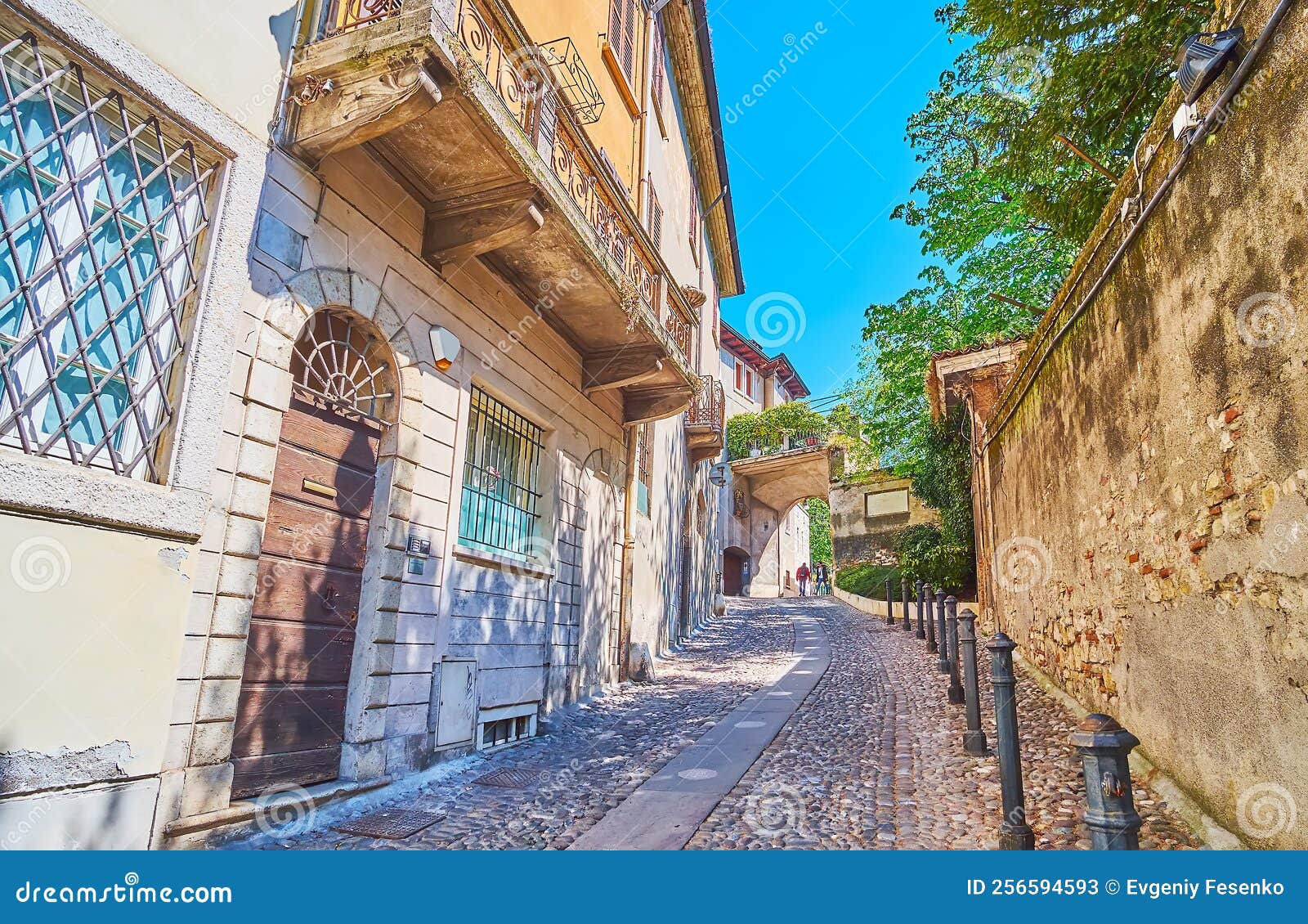 the narrow hilly contrada sant`urbano street, brescia, italy