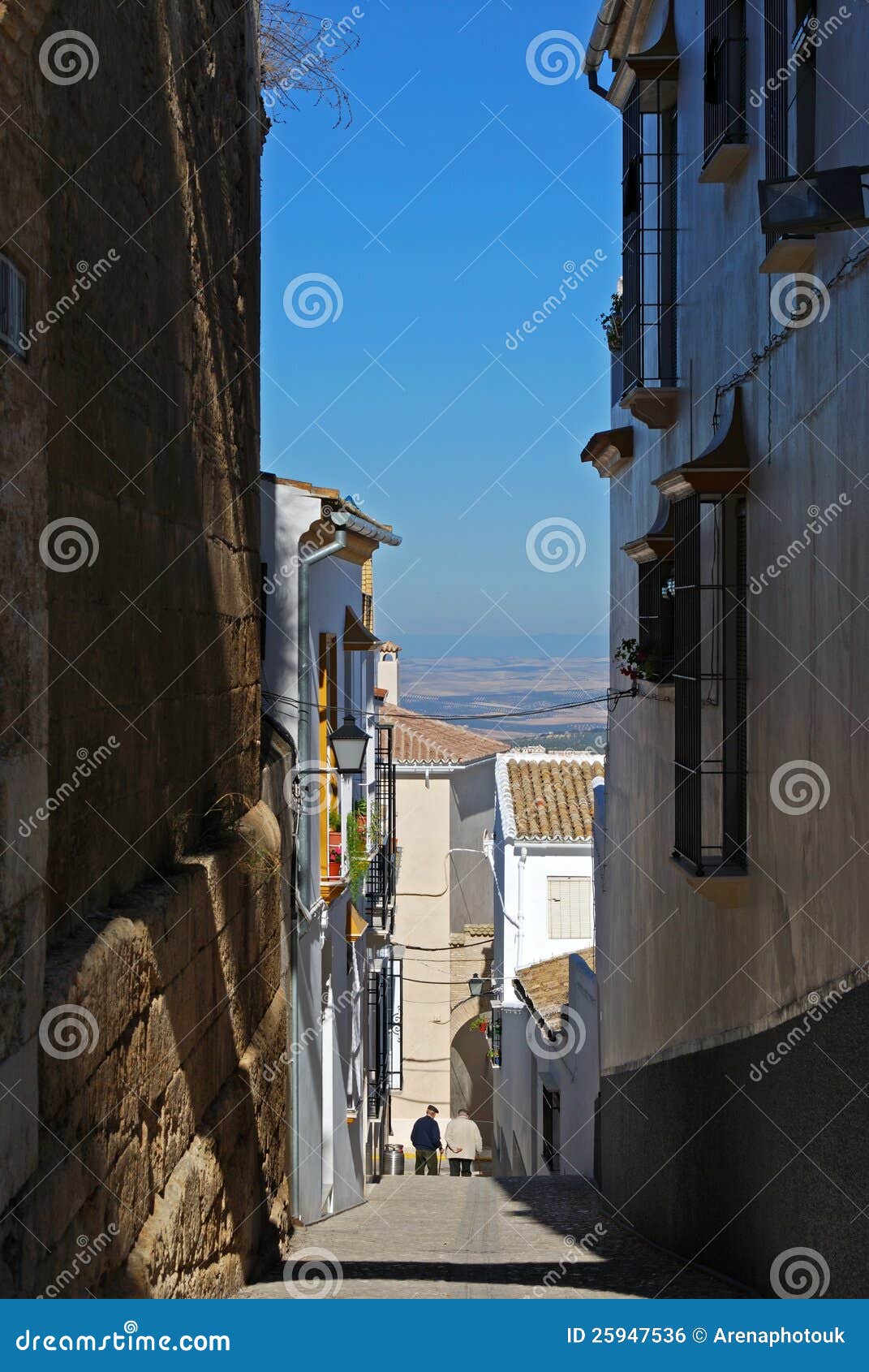 narrow village street, estepa, spain.