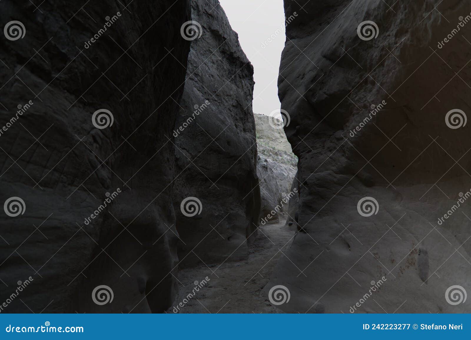 the narrow walls of the los hoyos trail in the gray desert of tatacoa, colombia