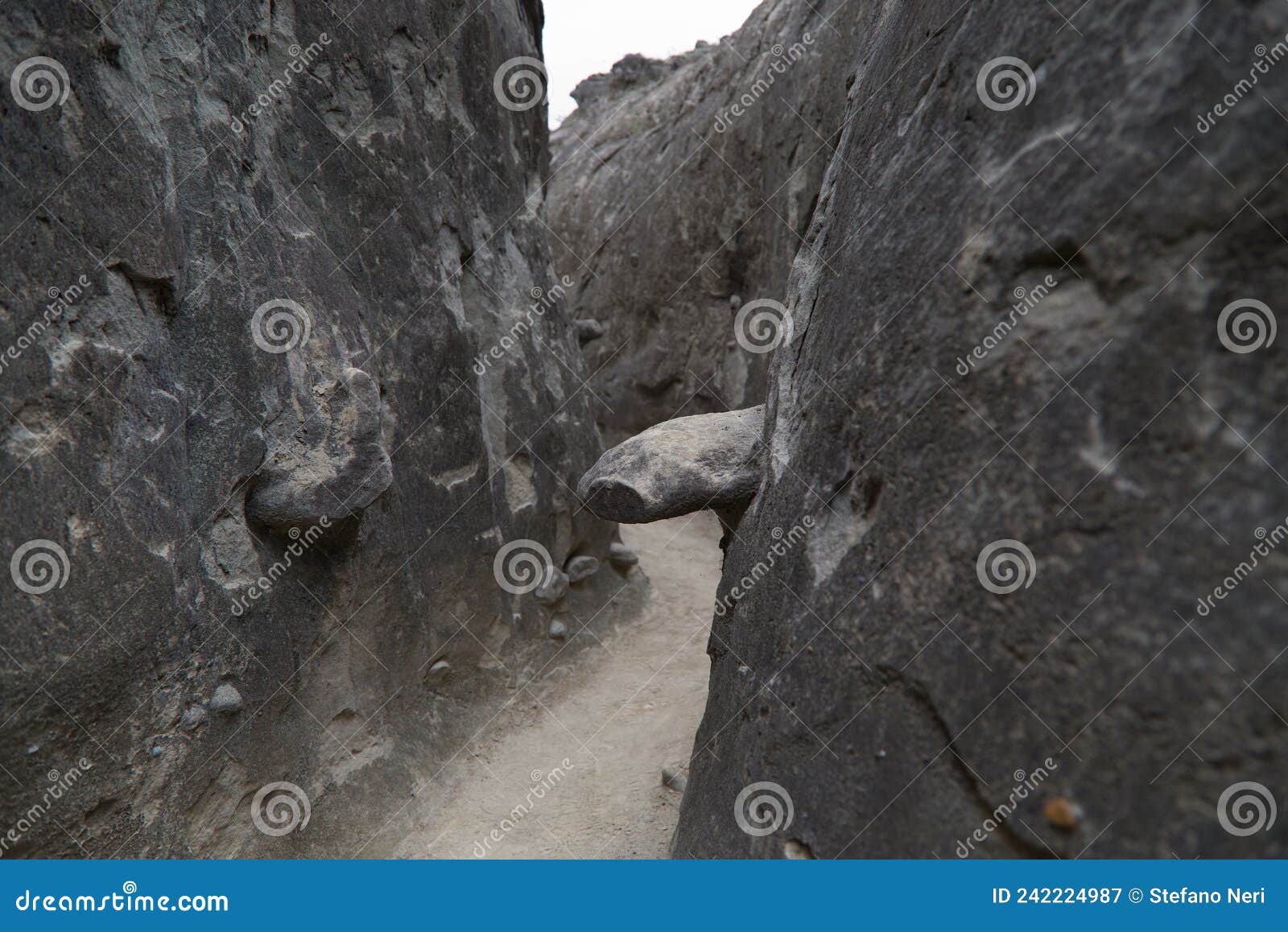 the narrow walls of the los hoyos trail in the gray desert of tatacoa, colombia