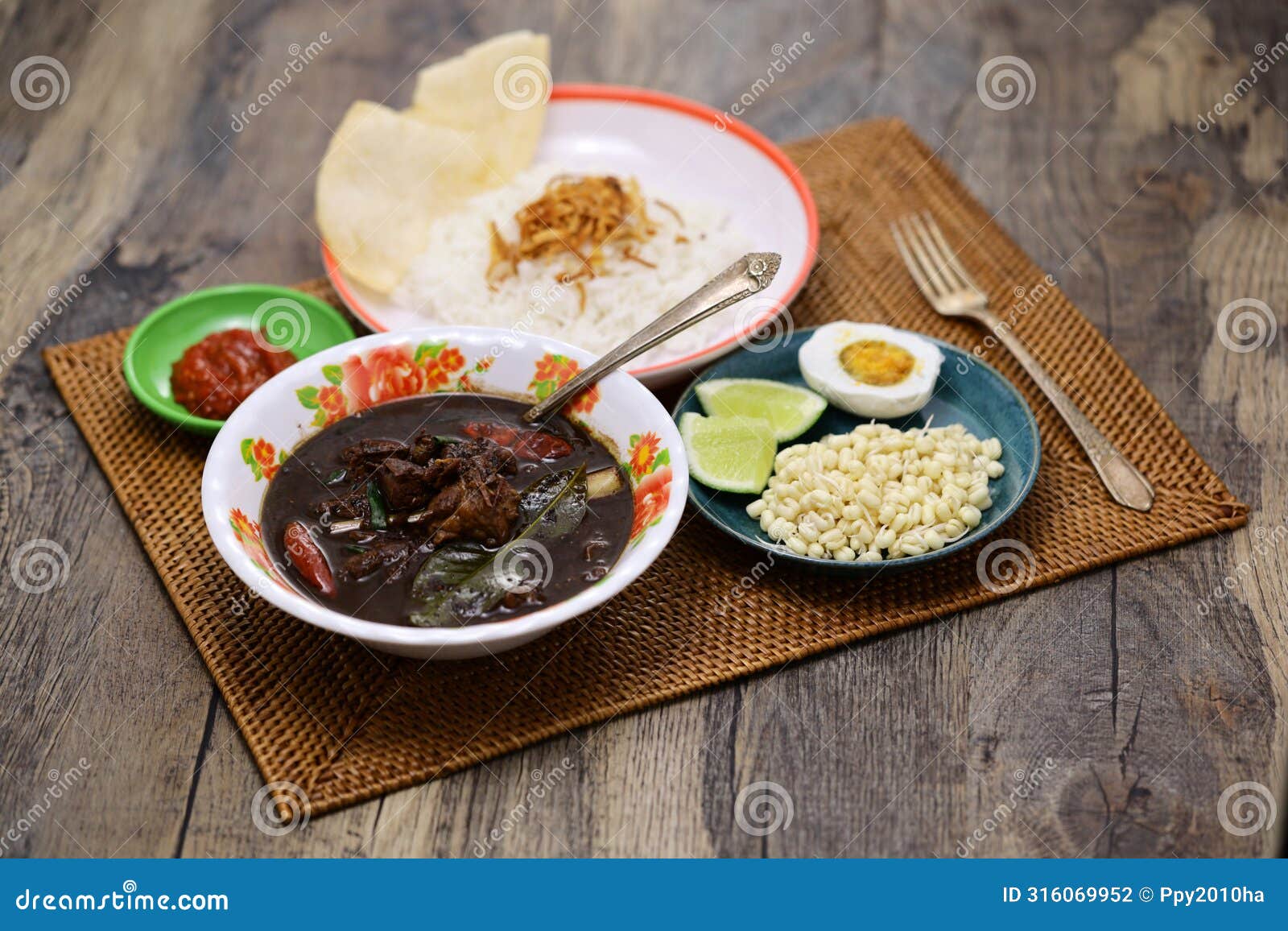 nasi rawon, indonesian black beef soup with rice.