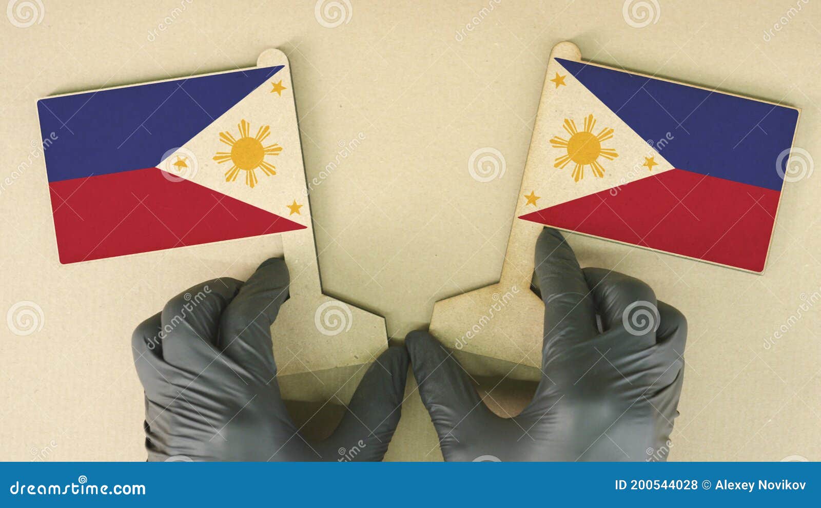 Flags of Philippines Made of Recycled Paper on the Cardboard Table