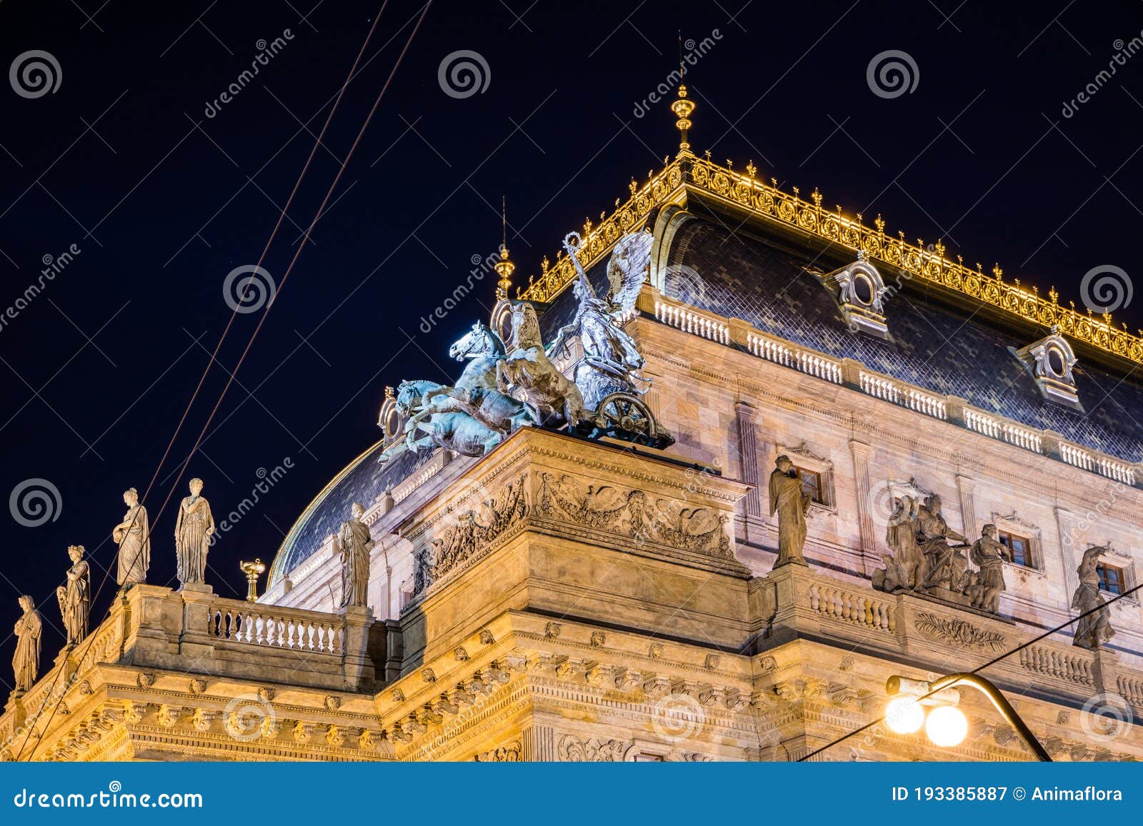 national theater in prague illuminated in the evening