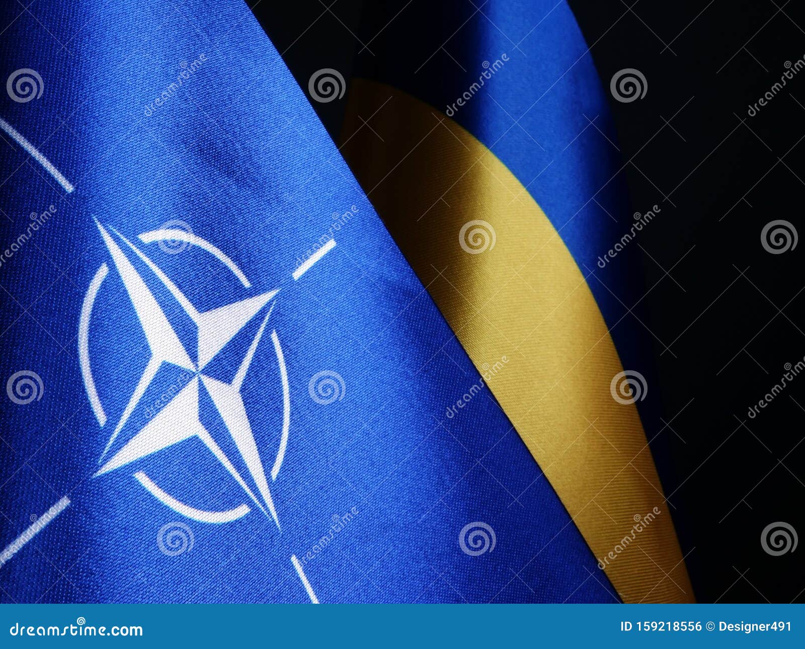 nato and ukraine flags as  of cooperation