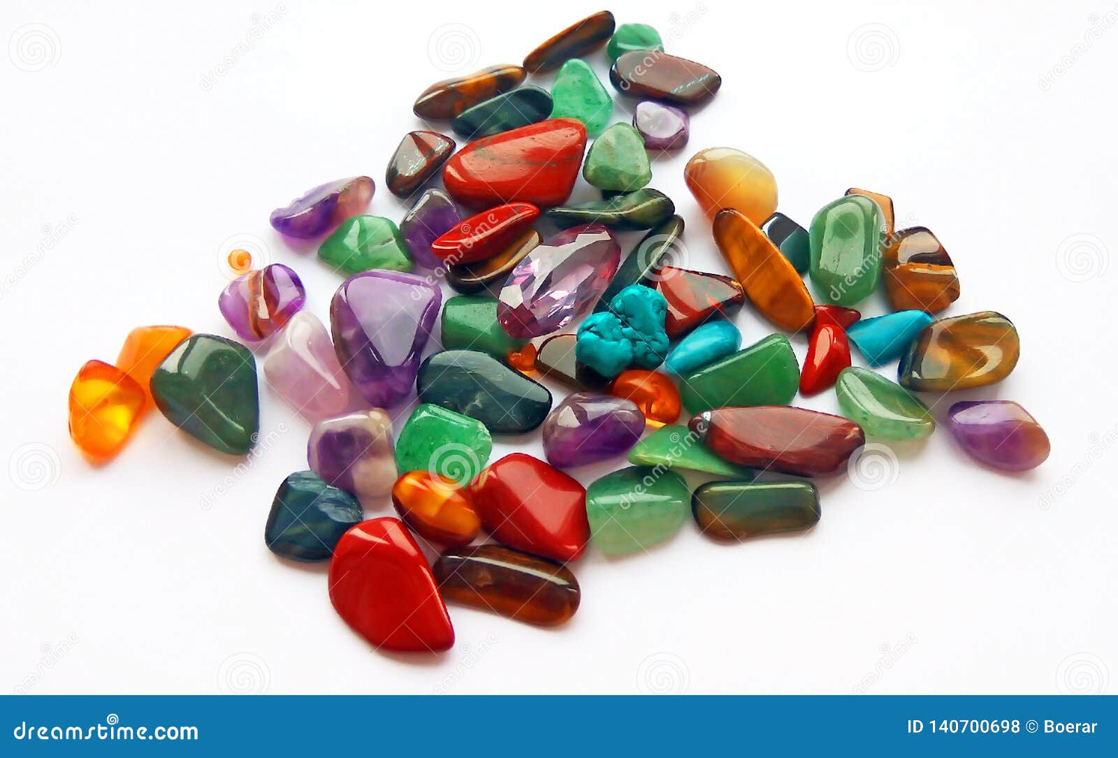 natural bright coloured semi precious gemstones and gems on white background
