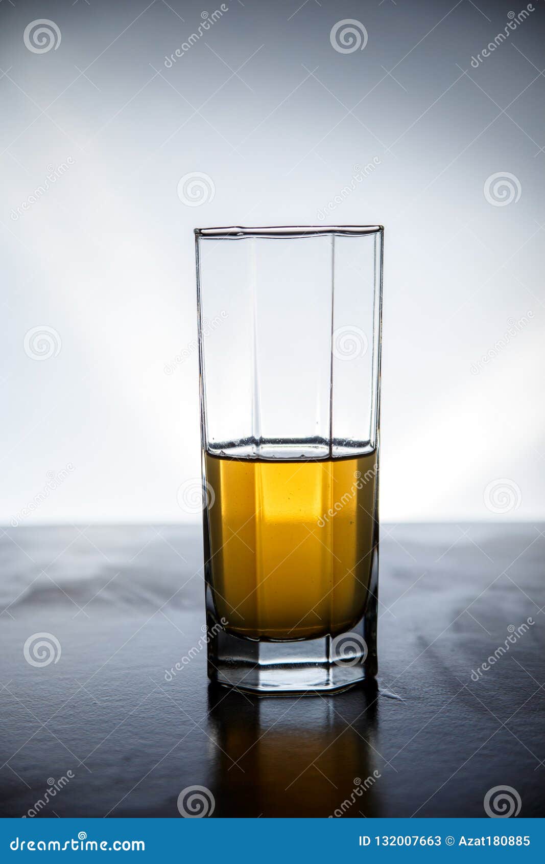 Download Natural Drink Of Dark Yellow Color Is Typed In A Glass On A Lighted Background Stock Image Image Of Alcoholic Glass 132007663 Yellowimages Mockups