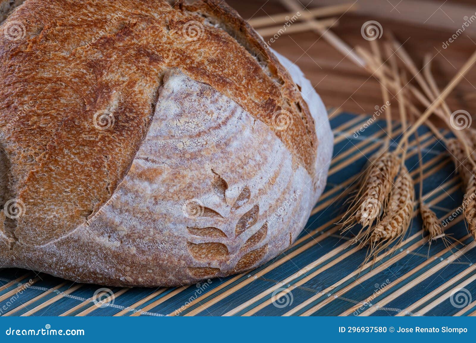 Natural Fermentation Artisanal Bread Ready on Table Next To Wheat