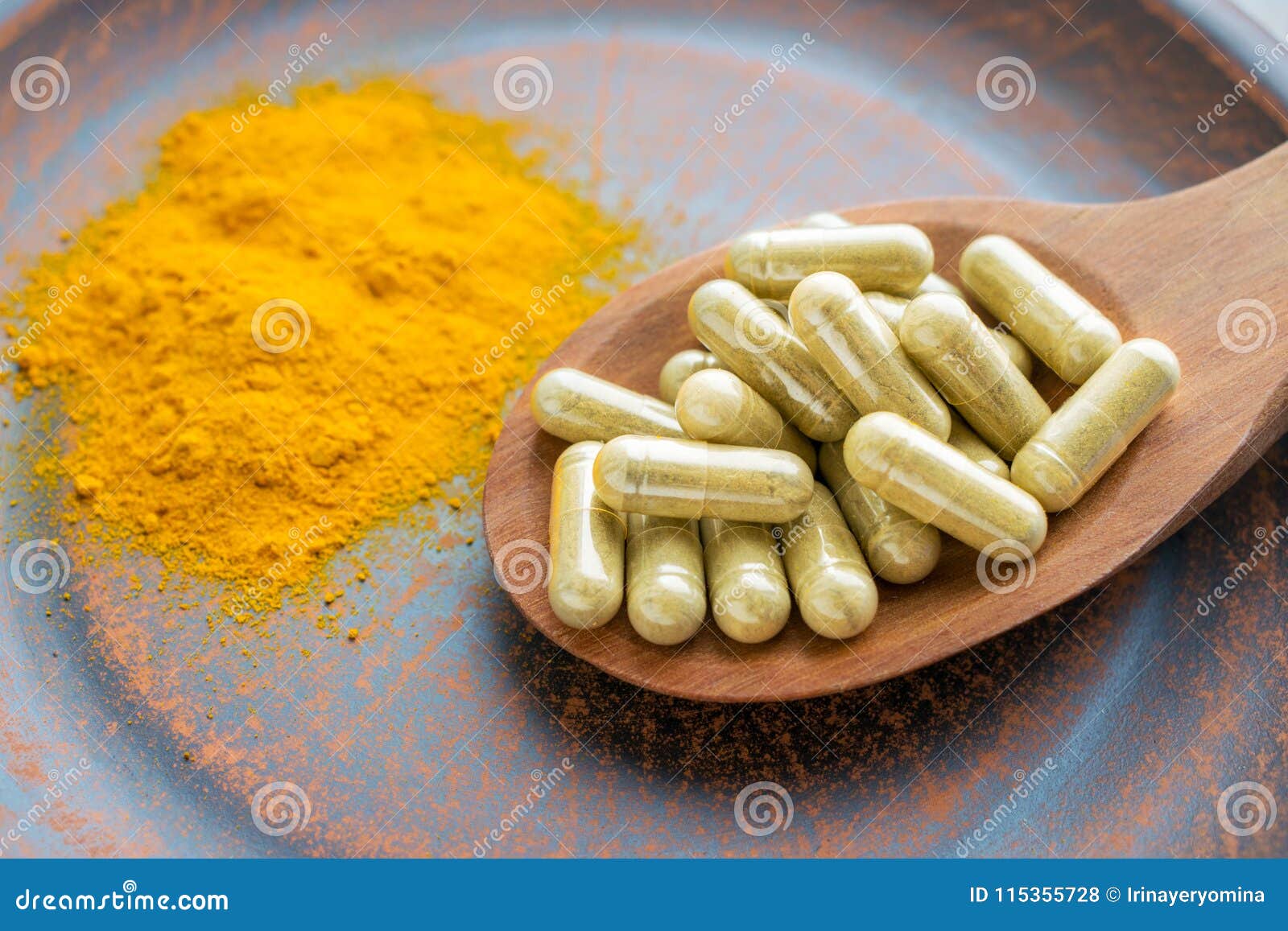 natural herb food supplement turmeric veggie capsules and spoon