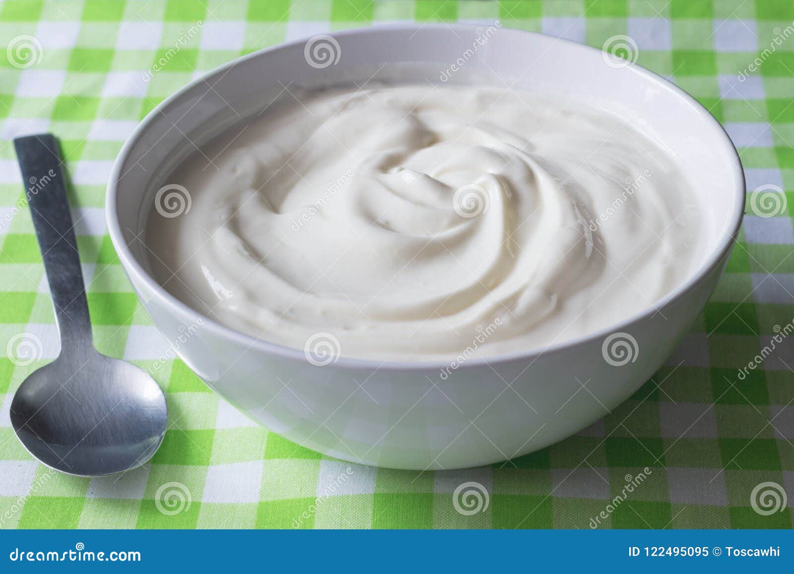 natural plain white greek yoghurt in bowl closeup - yogurt background