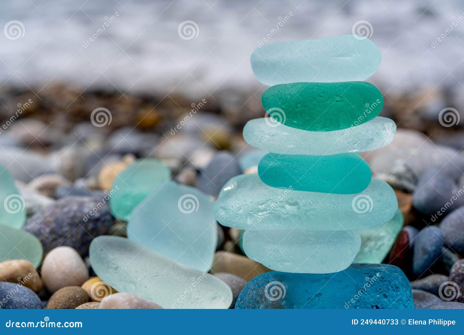 Colorful gemstones on a beach. Polish textured sea glass and