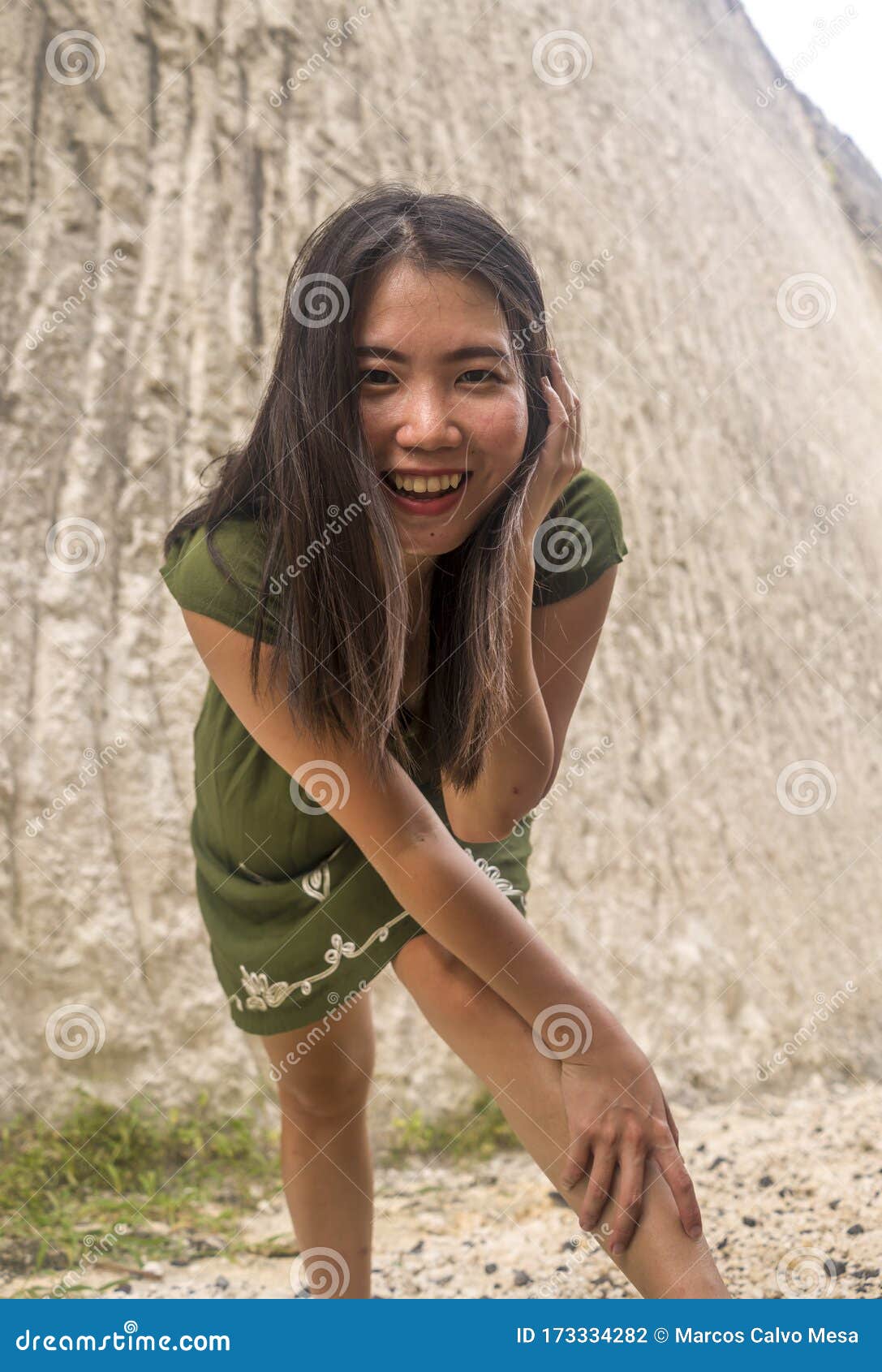 Natural Portrait Of Young Beautiful And Happy Asian Korean Woman In Green Summer Dress Posing 