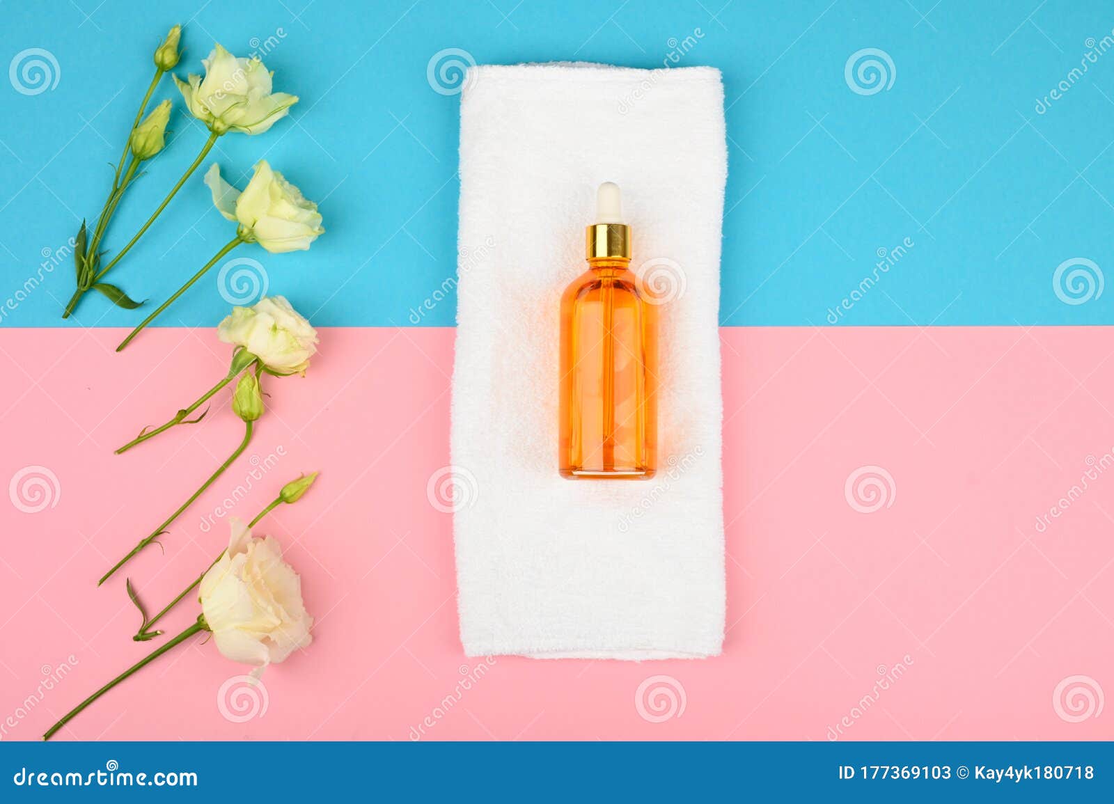 natural spa oils. on a yellow-green background. open and closed buds, place for an inscription. flat lay