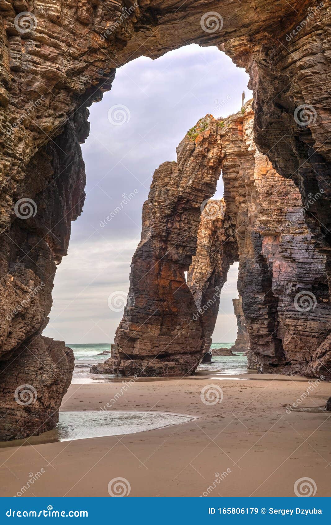 natural stone archs on playa de las catedrales, spain