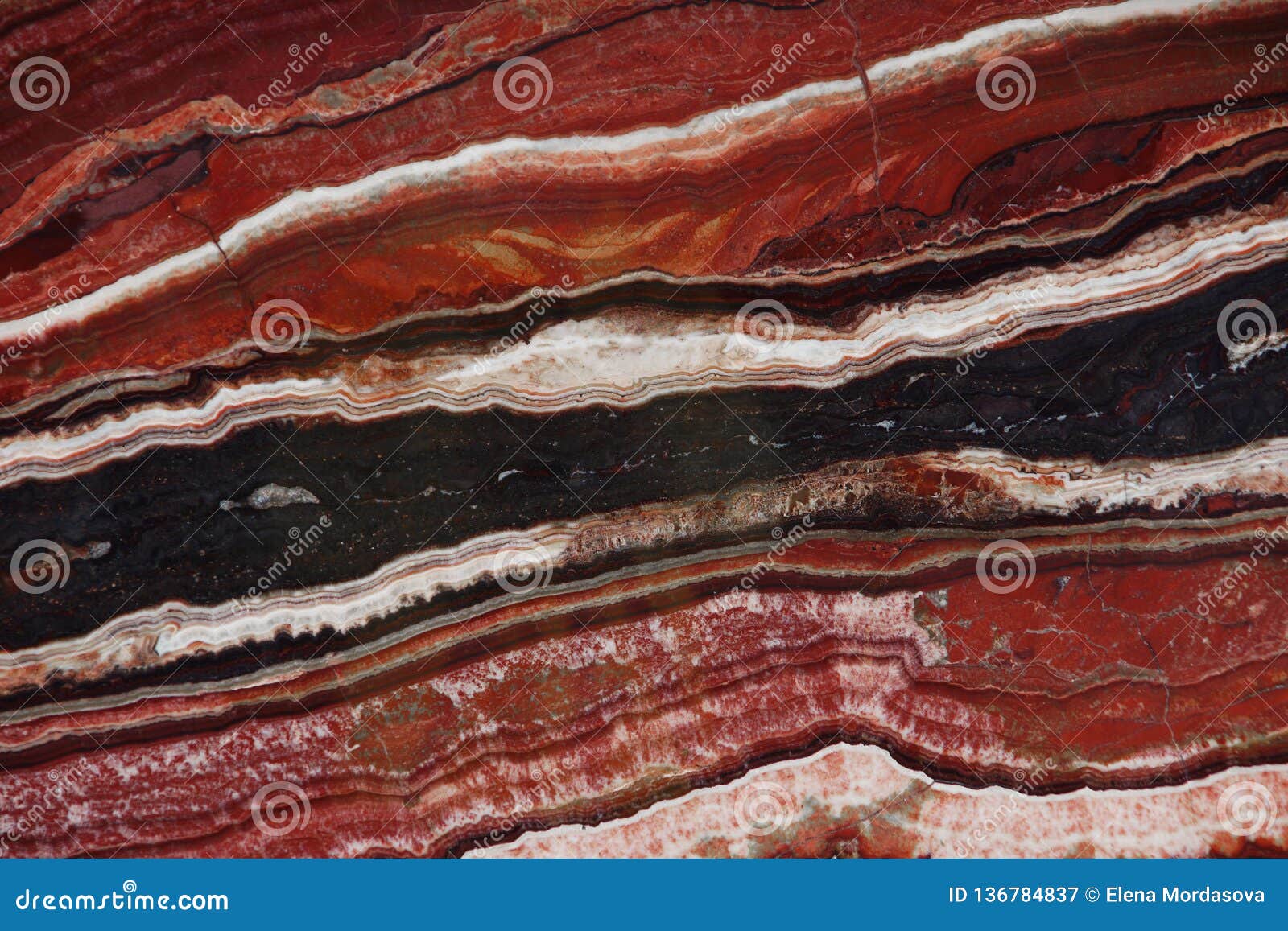 natural stone of red color with a pattern called onice fantastico