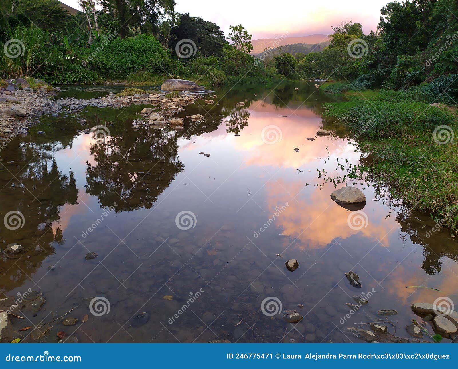 natural sunset landscape with river and clouds. paisaje natural de atardece con rÃÂ­o y nubes