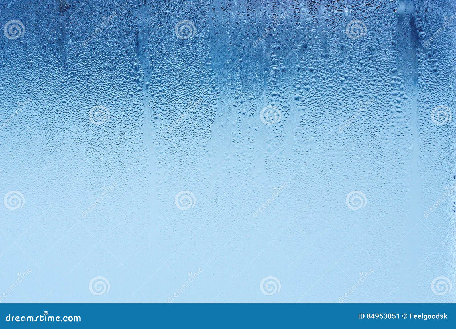 natural water drops on glass, window glass with condensation, strong, high humidity, large drops of water flow down the window, co