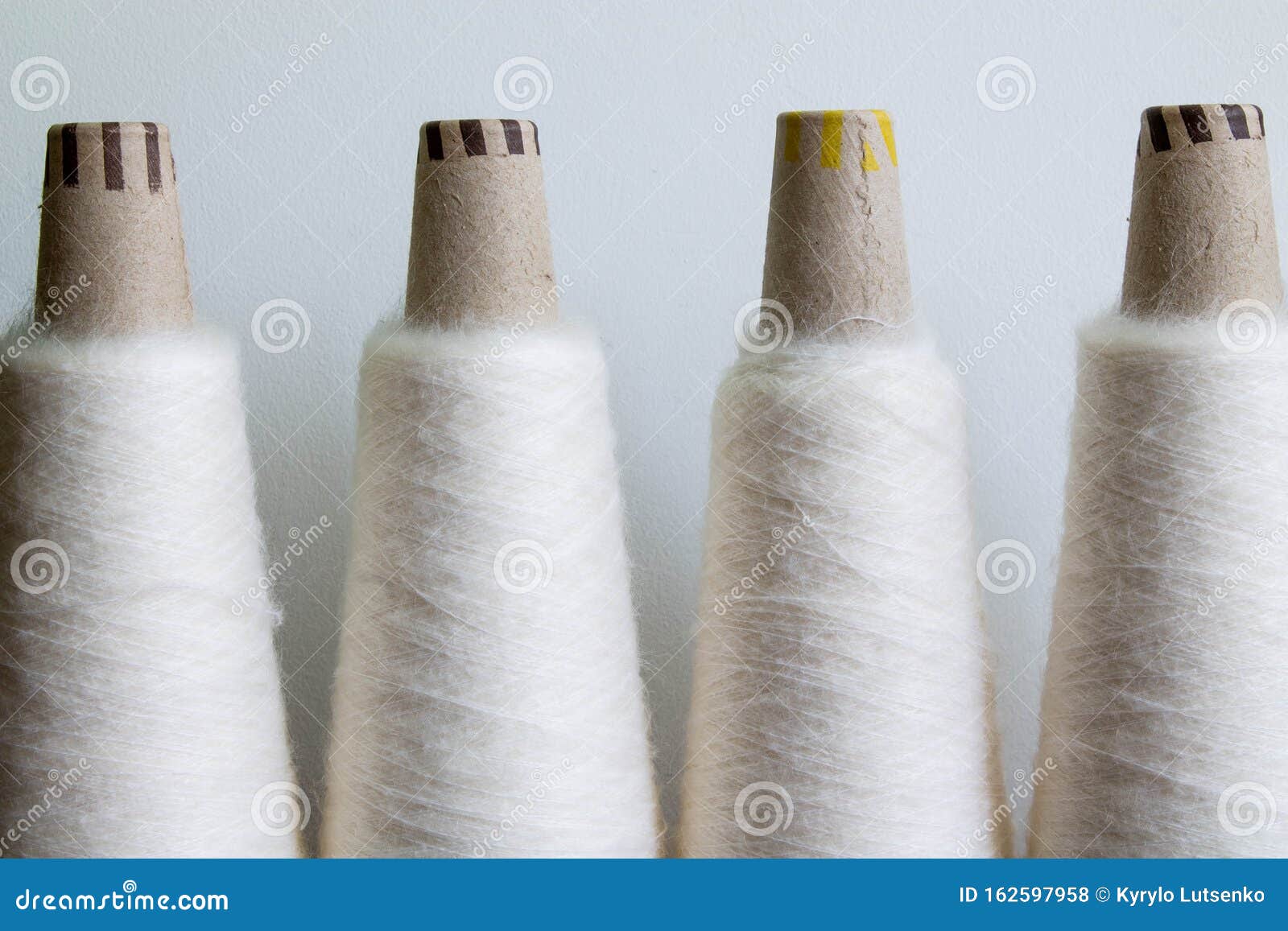 Natural wool bobbin yarn stock photo. Image of isolated 162597958