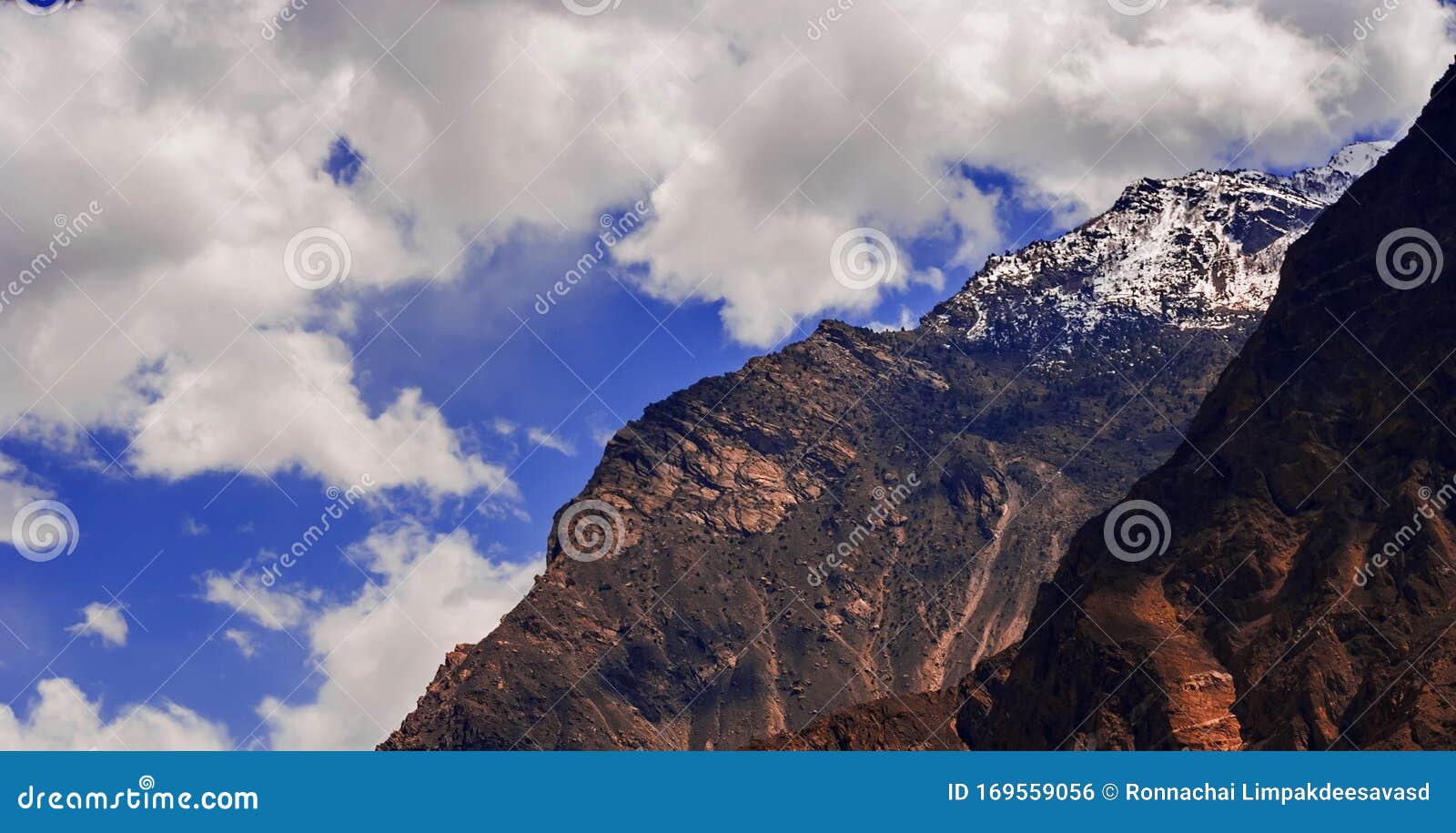 nature landscape view of snow capped rakaposhi peak in karakoram mountain range in nagar valley. autumn scenery in gilgit baltista