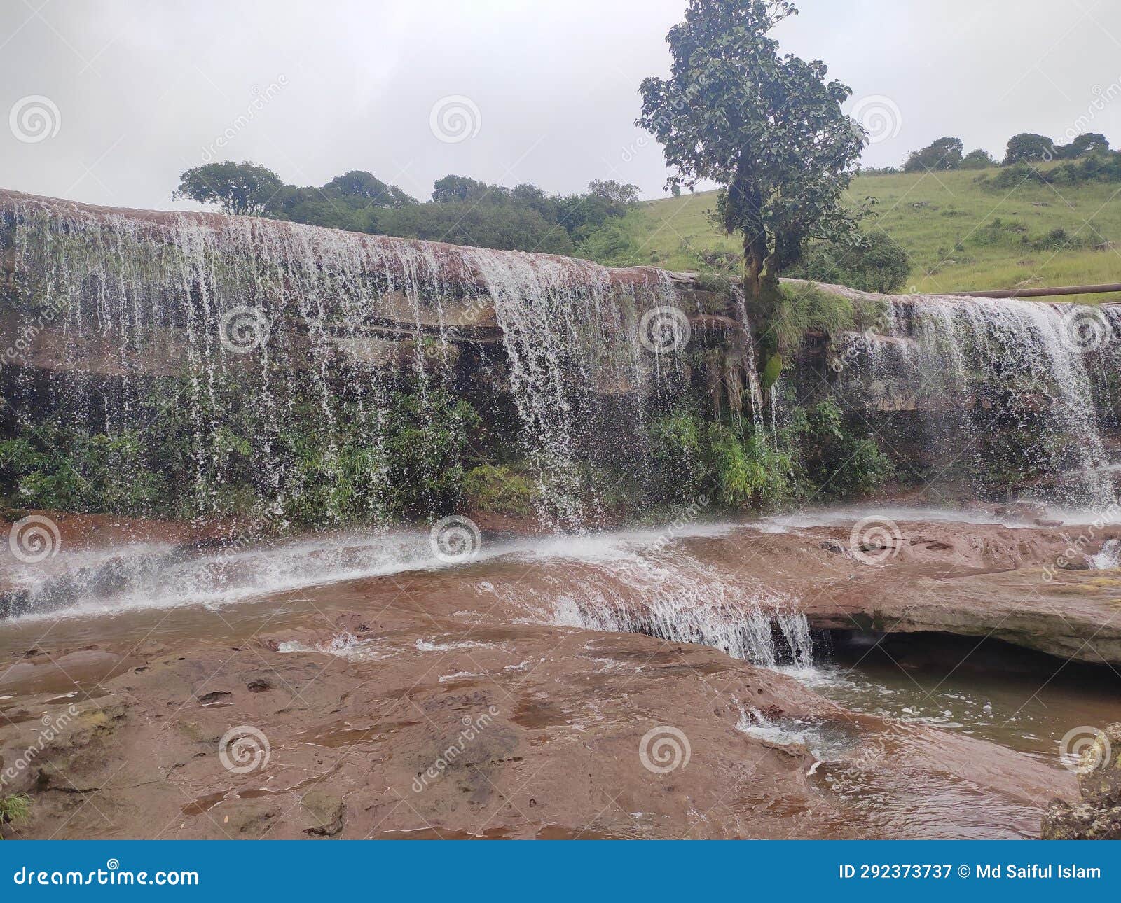 Nature S Masterpieces Unite with a Breathtaking Waterfall Surrounded by